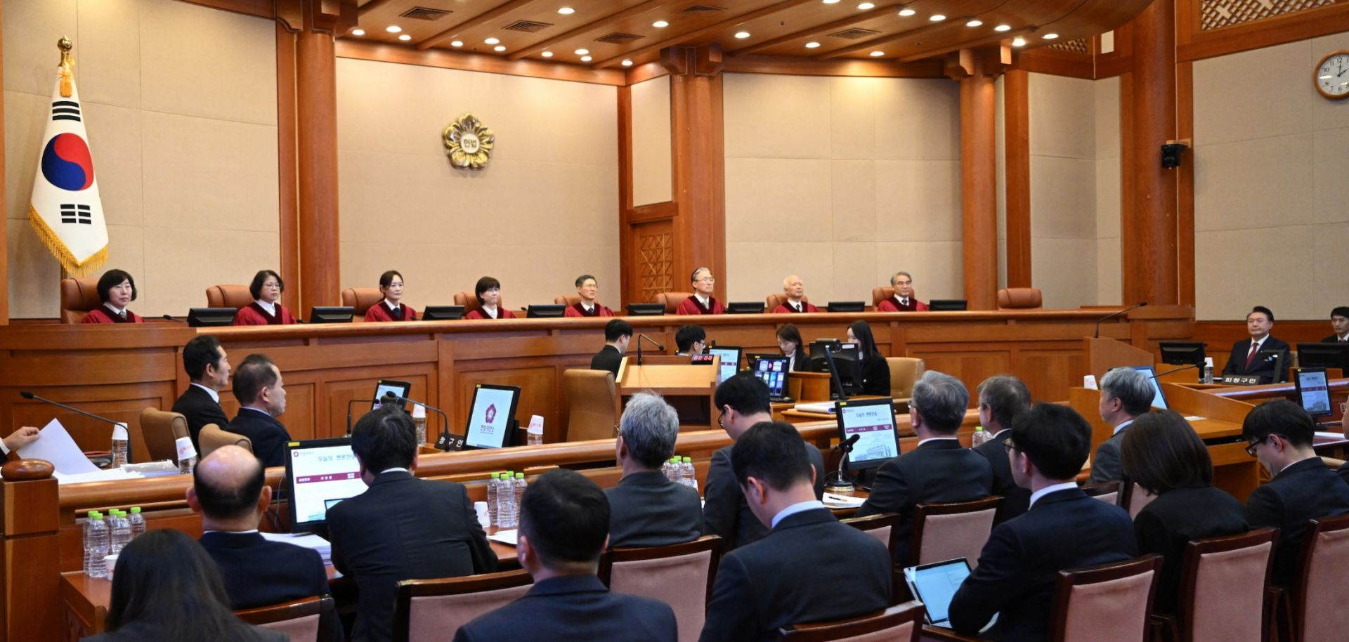 South Korean President Yoon Suk Yeol (second from right) attends the fifth hearing of his impeachment trial over his short-lived imposition of martial law at the Constitutional Court in Seoul on Feb. 4, 2025.