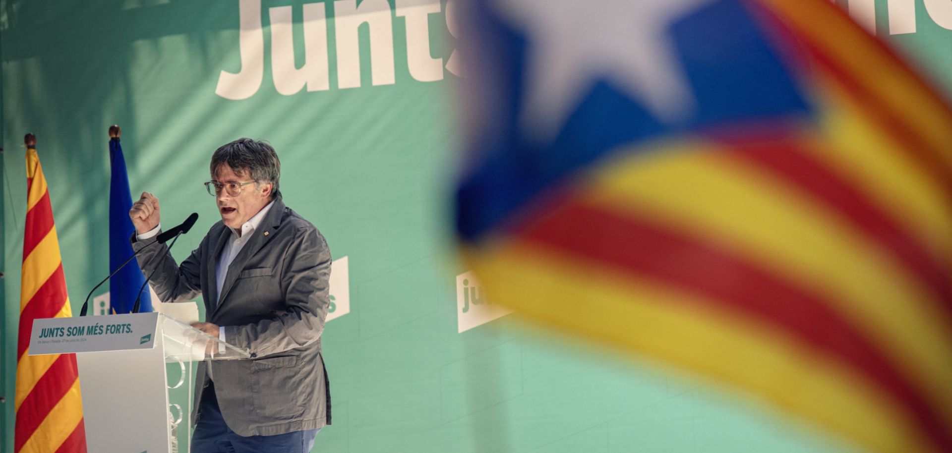 Carles Puigdemont, leader of Catalonia's pro-independence Junts party, delivers a speech in southwestern France on July 27, 2024, during a meeting held to celebrate the fourth anniversary of the party's founding. 