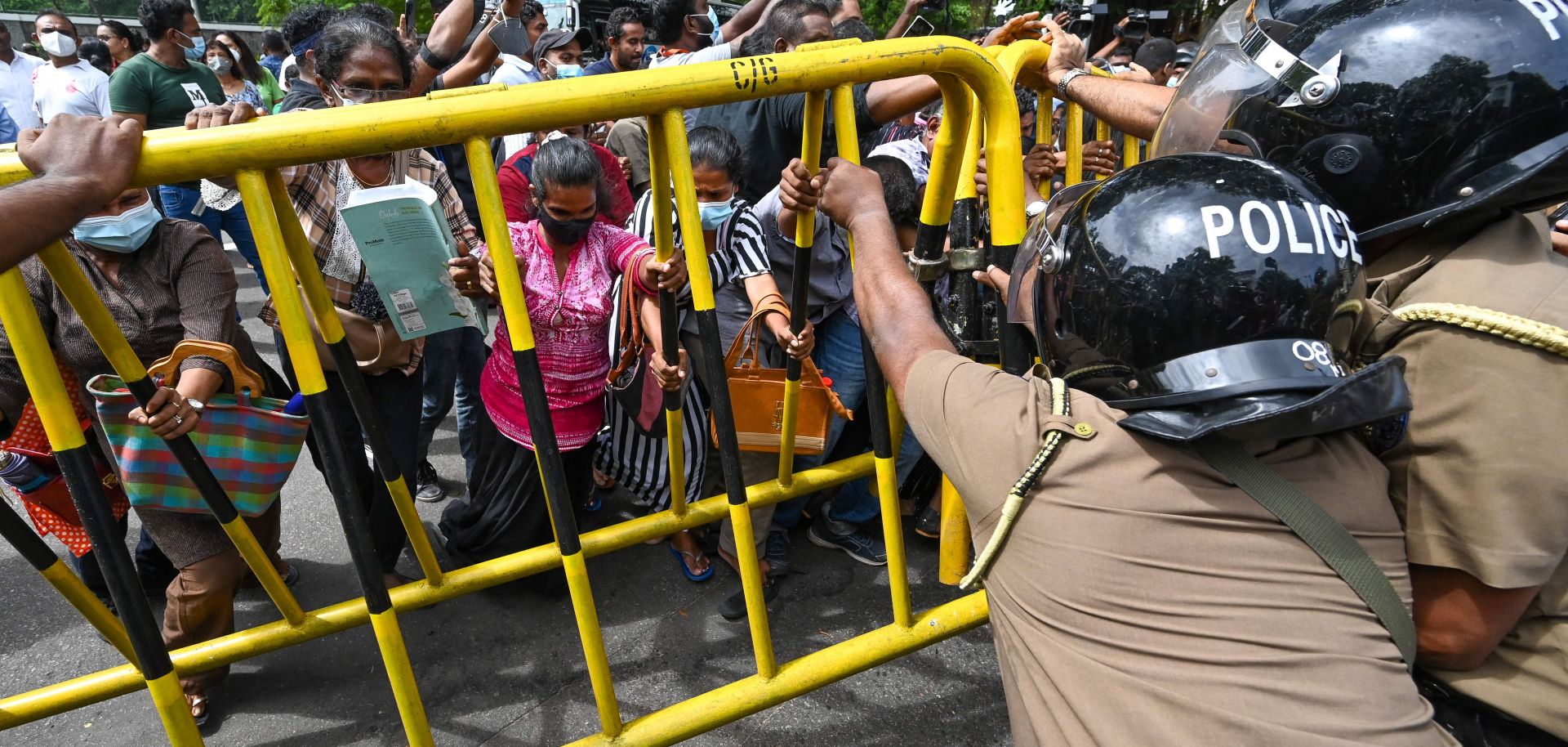 Opposition activists outside Sri Lankan Prime Minister Ranil Wickremesinghe's private residence on June 22, 2022, in Colombo, Sri Lanka.