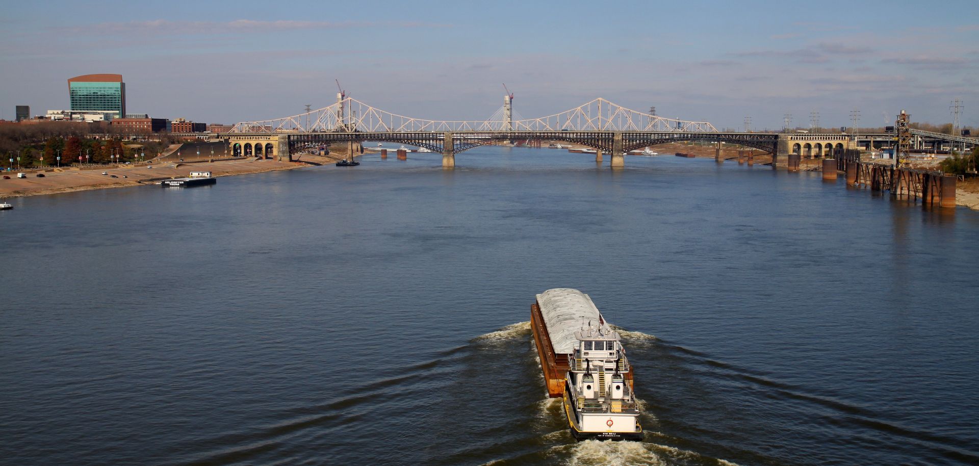 A tugboat pushes a barge up the Mississippi River, as photographed from I-55 in St. Louis, Missouri on NOVEMBER 04, 2012.