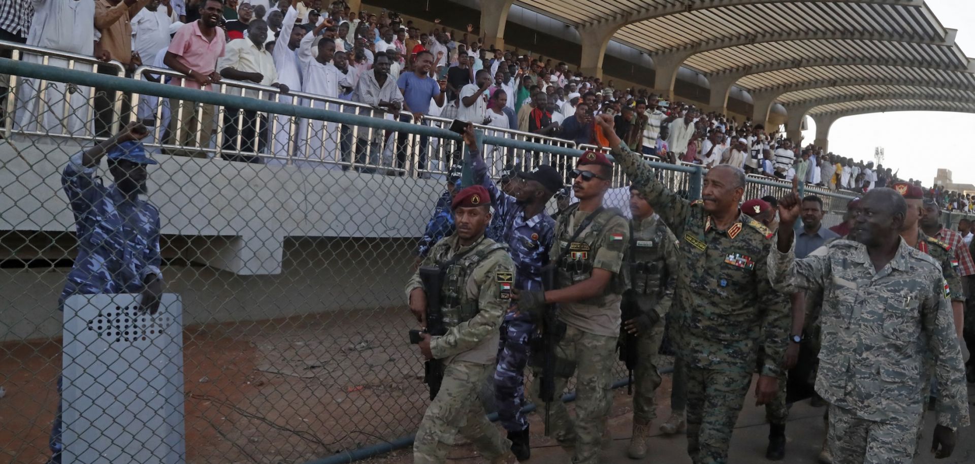 Sudan's de facto leader and army chief, Abdel Fattah al-Burhan, waves to spectators after attending a soccer match at Kober Stadium in Khartoum on May 15, 2026.