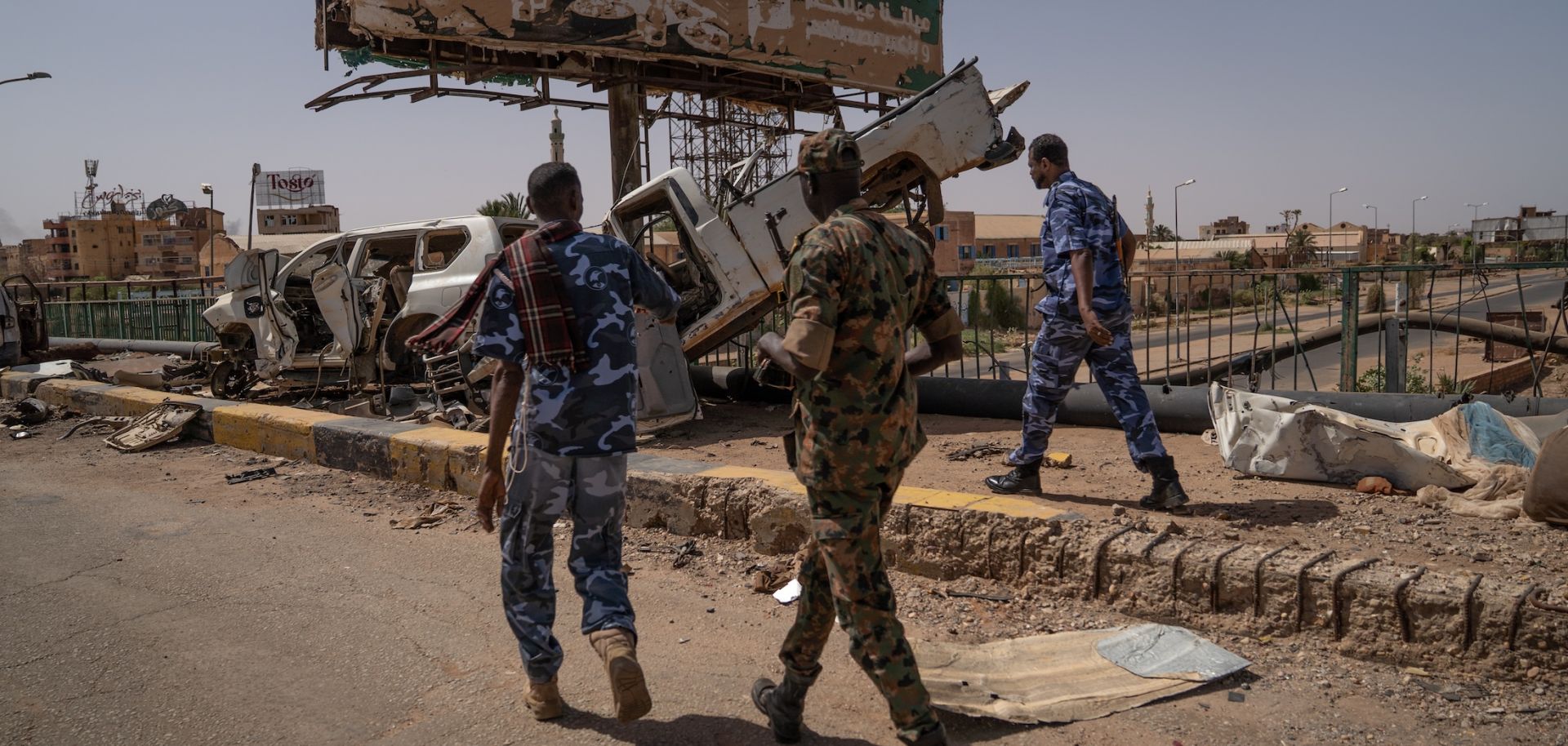 Sudanese Armed Forces soldiers are seen on the now-disabled Shambat Bridge in Khartoum. 