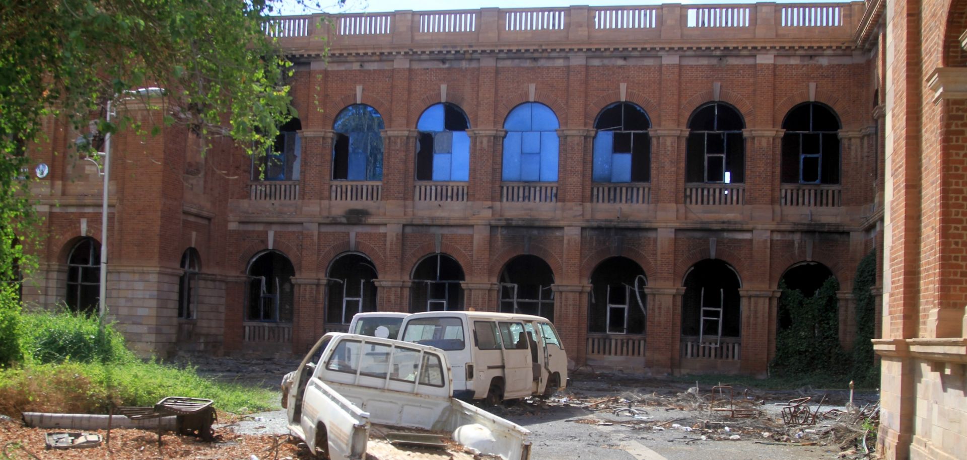 Destroyed vehicles are strewn outside Sudan's finance ministry building in the capital Khartoum on Jan. 17, 2026, after nearly three years of devastating war in the country.