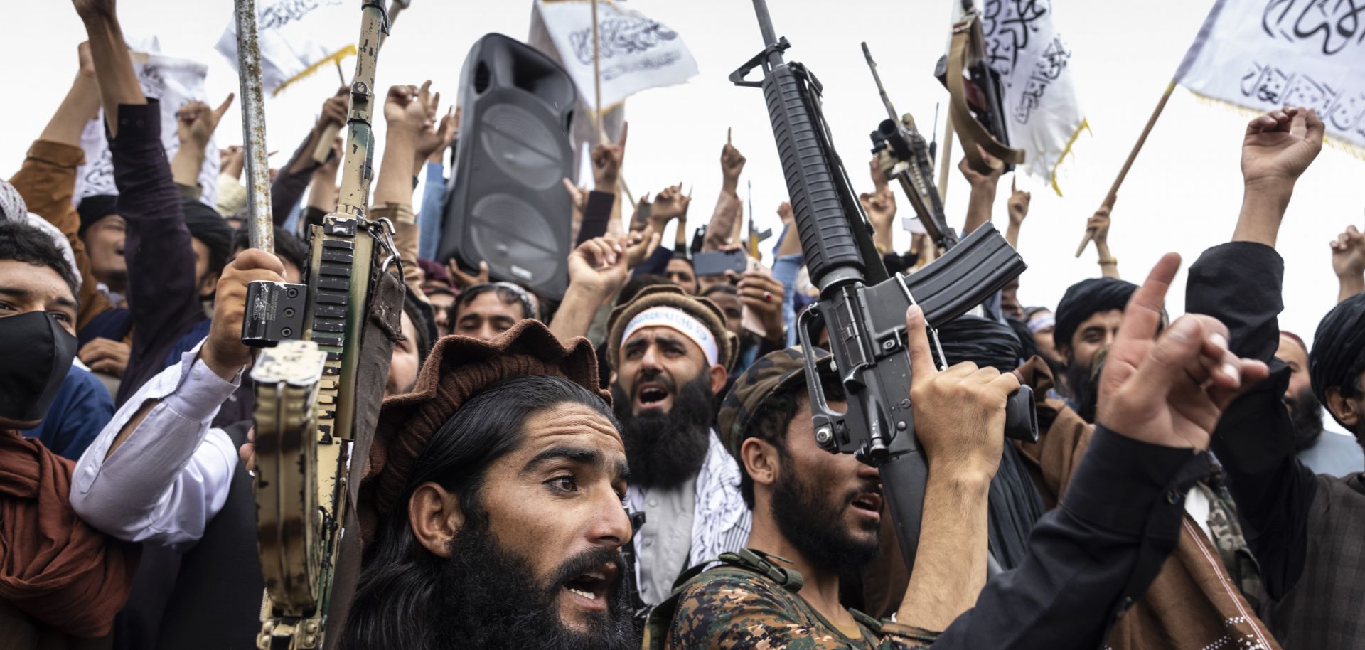 Taliban fighters take to the streets during a national holiday celebrating the first anniversary of the group’s takeover on Aug. 15, 2022, in Kabul, Afghanistan. 