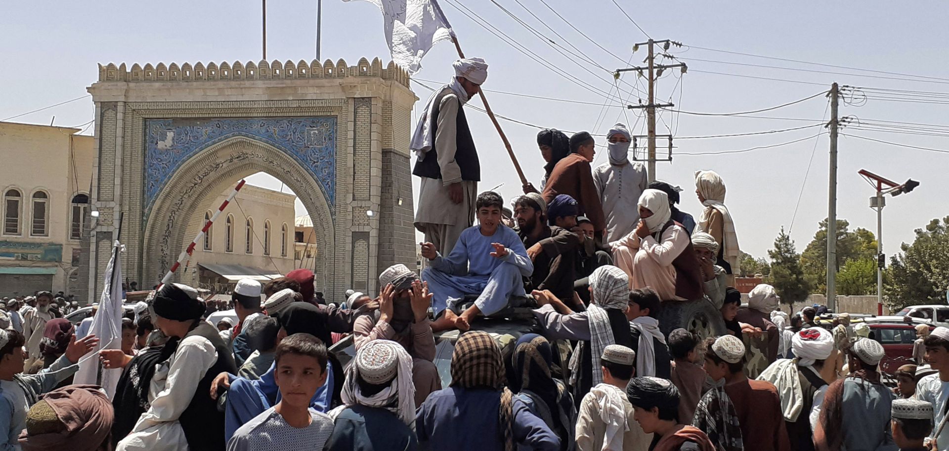 Taliban fighters stand on a vehicle in Kandahar, Afghanistan, on Aug. 13, 2021. 