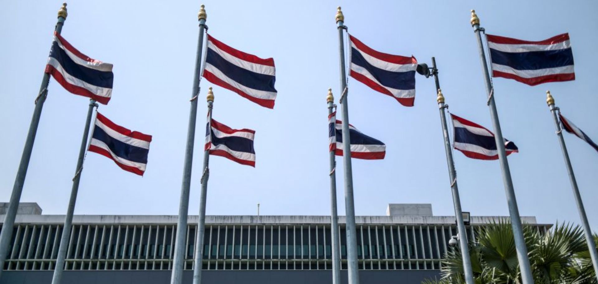Thai flags March 4, 2023, on the side of the parliament complex in Bangkok.