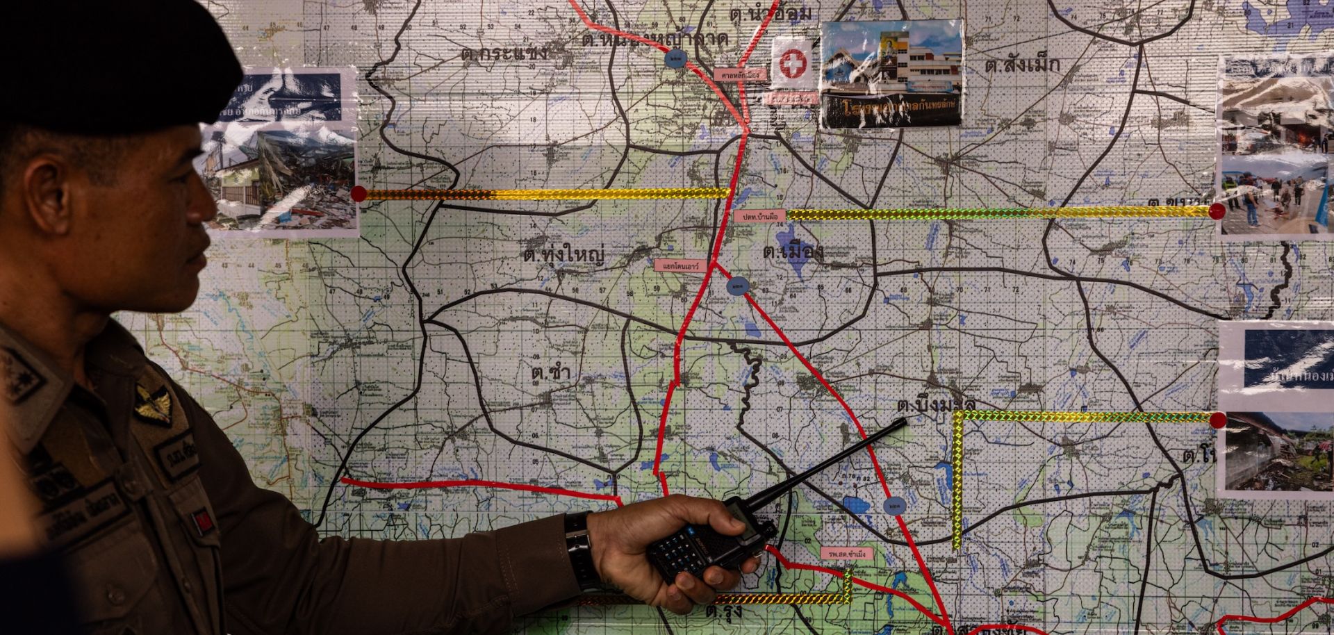 A Thai soldier points out an area on a map near the Cambodian border during a press visit on Aug. 16, 2025, in Sisaket, Thailand. 