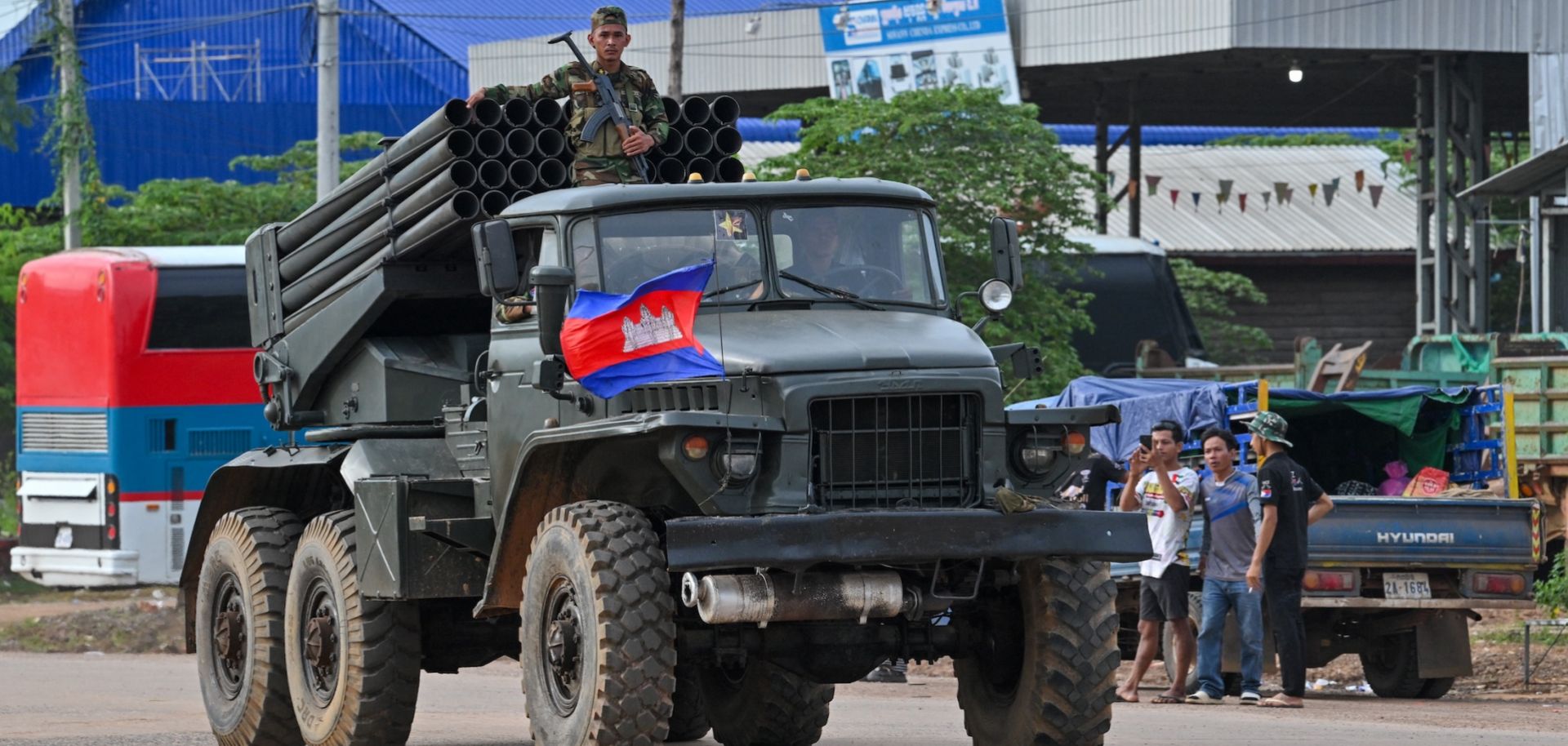 A Cambodian soldier stands on a truck with a rocket launcher in Cambodia's Oddar Meanchey province, which borders Thailand, on July 25, 2025.