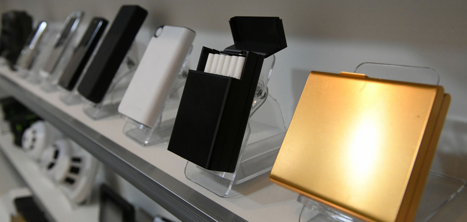 A shop in South Korea displays cigarette cases equipped with hidden cameras, among a wide selection of other spy cam devices. 
