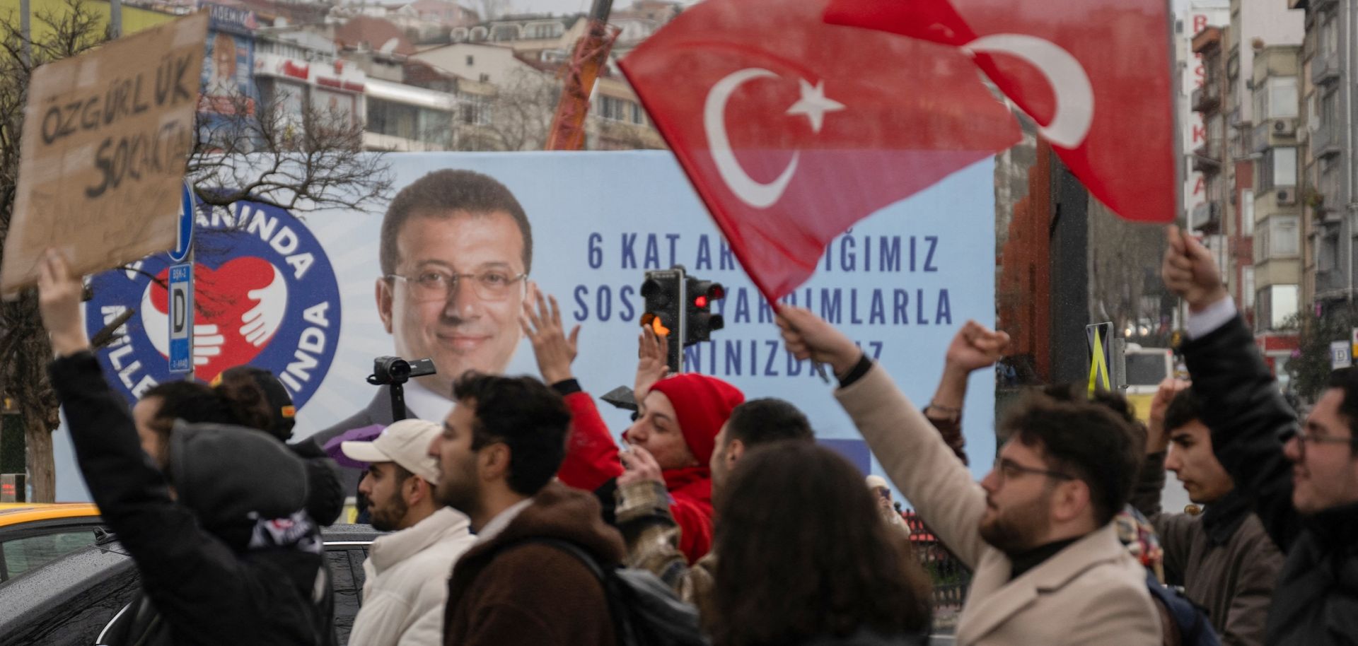 People wave Turkish national flags as they protest in Istanbul on March 20, 2025, following Mayor Ekrem Imamoglu's detention over a corruption probe.