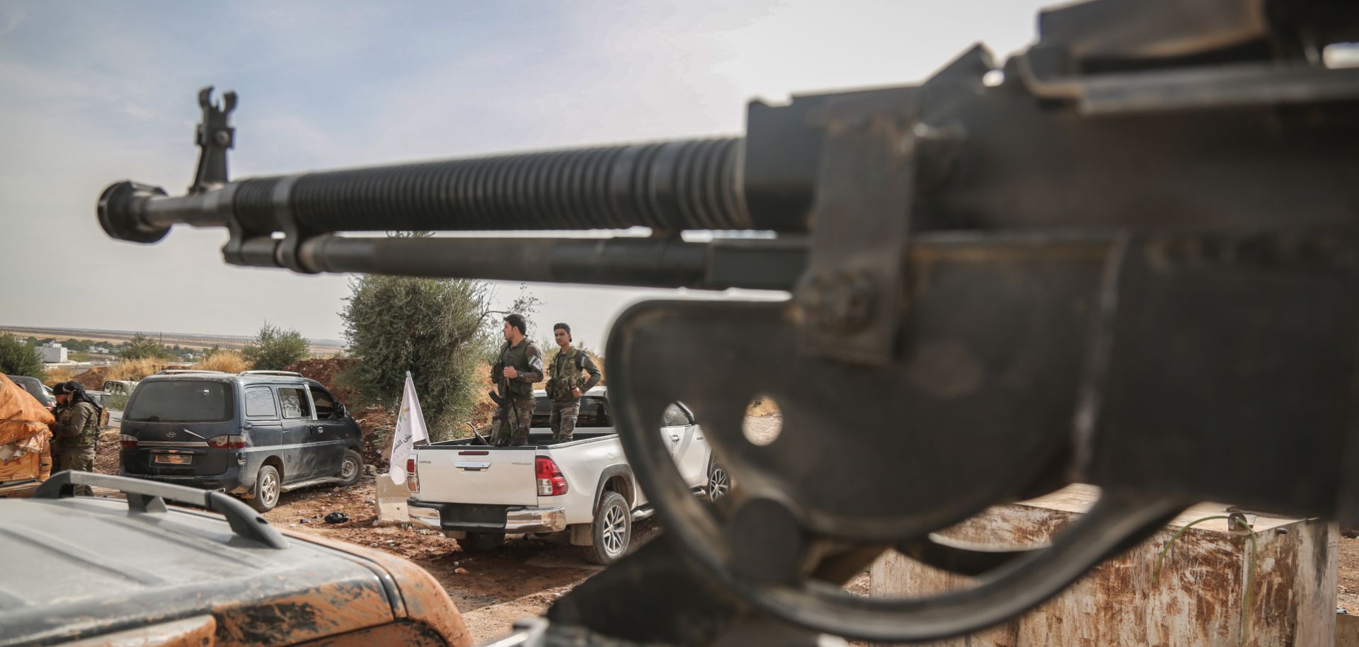 This photo shows fighters with the Turkish-backed Syrian National Army gathered near the Turkish border in northeastern Syria on Oct. 11, 2019.