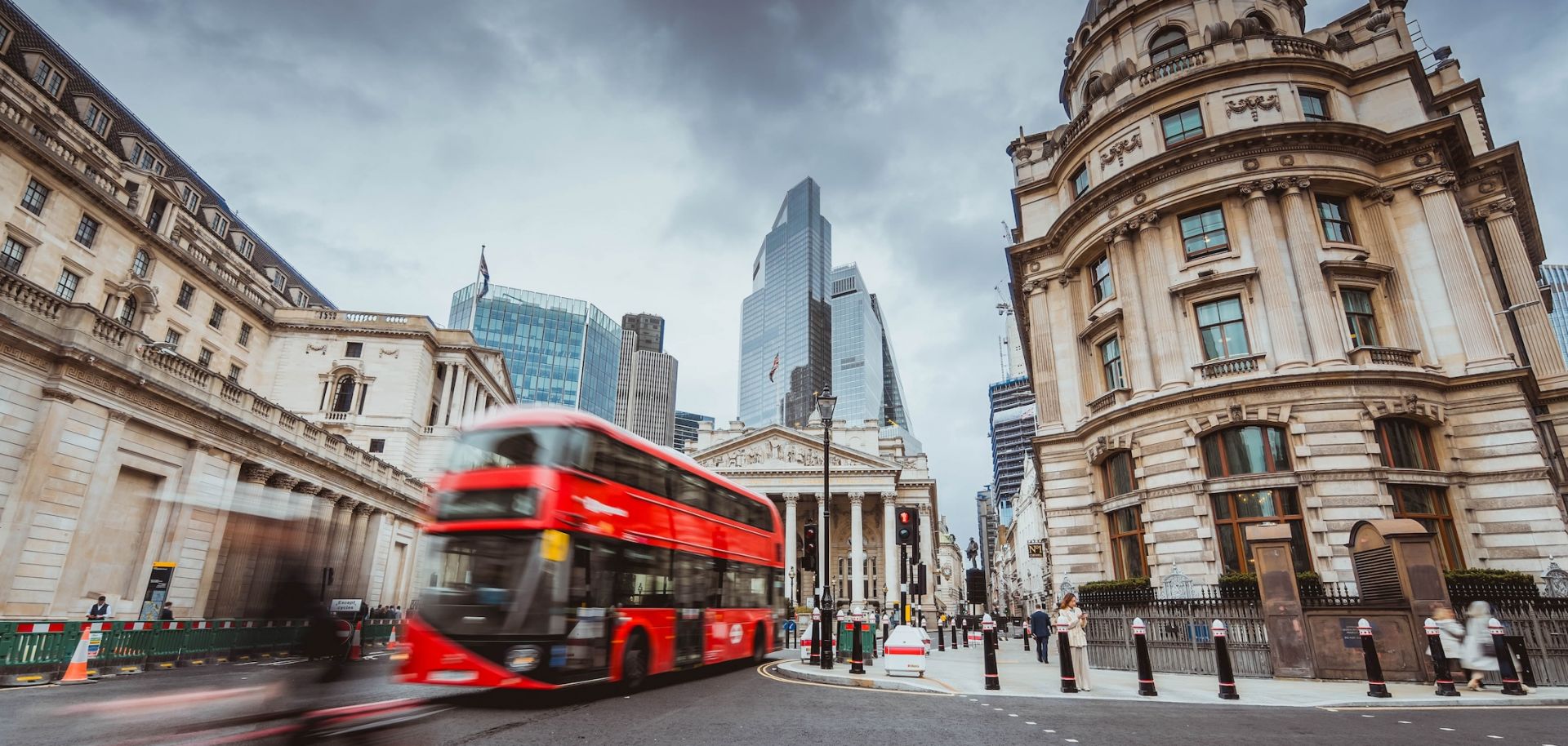 A stock photo shows a street scene in the financial district of London. 
