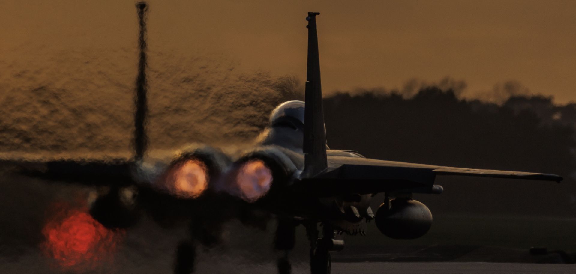 An F-15 fighter plane takes off from RAF Lakenheath at sunset on Jan. 7, 2026 in Mildenhall, the United Kingdom.