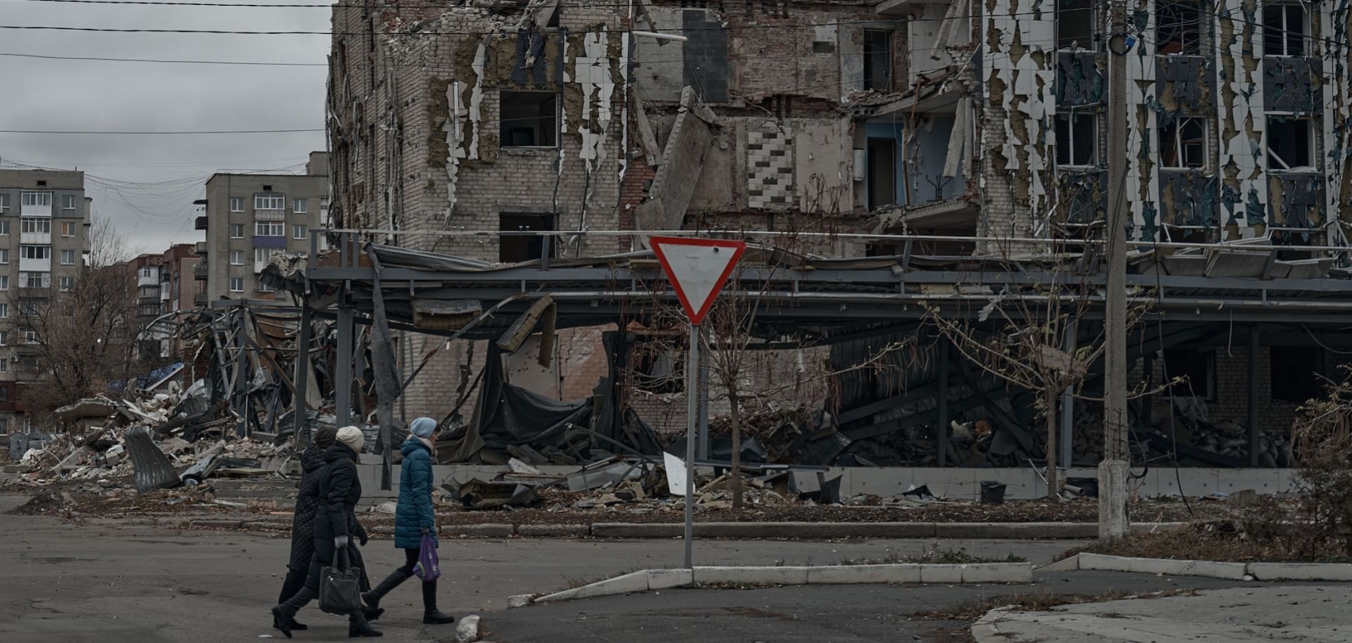 People walk by destroyed houses in Pokrovsk, Ukraine, on Nov. 16, 2024.