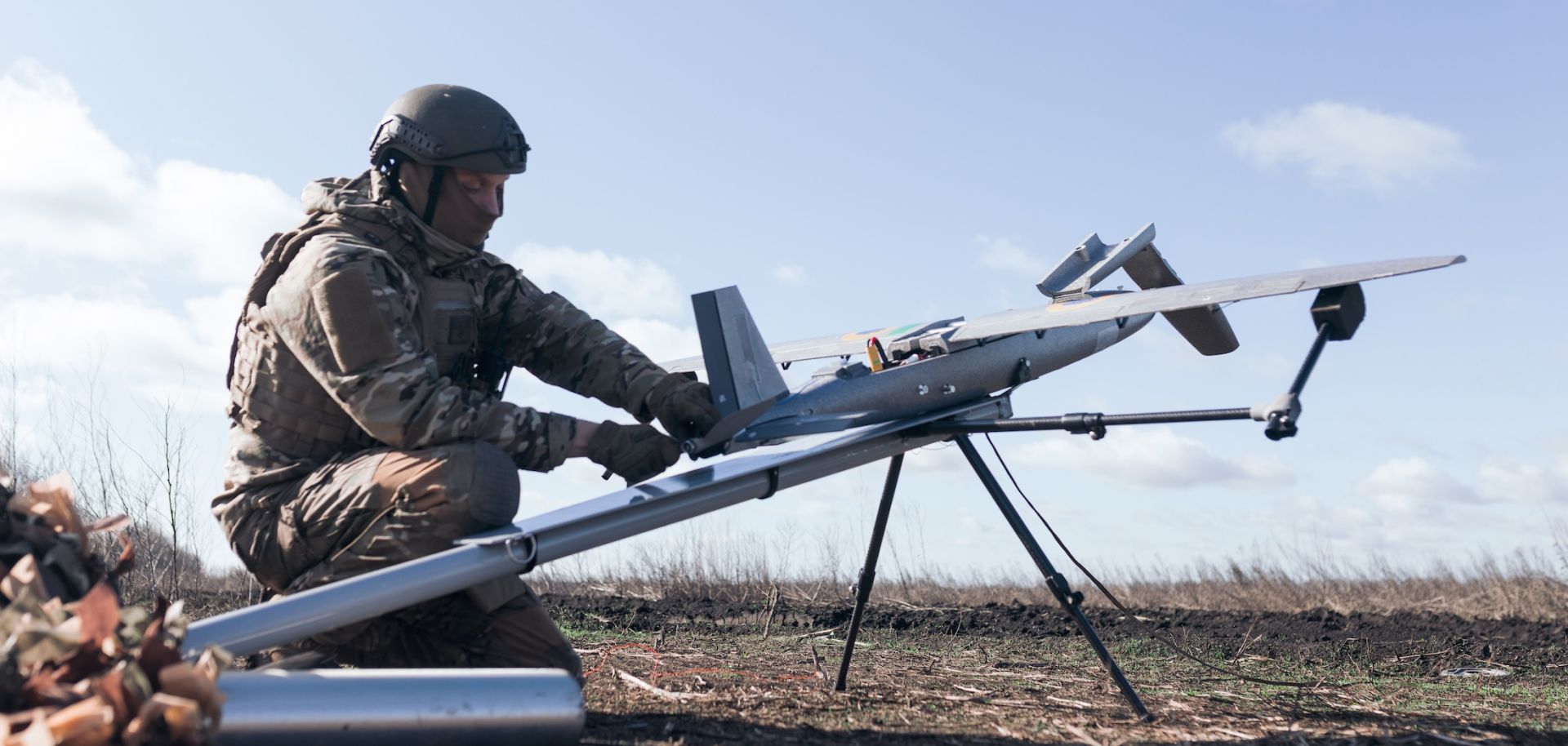 A soldier from the "Taifun" unmanned aerial vehicle unit prepares a new strike drone for flight on April 7, 2026 in Ukraine. 