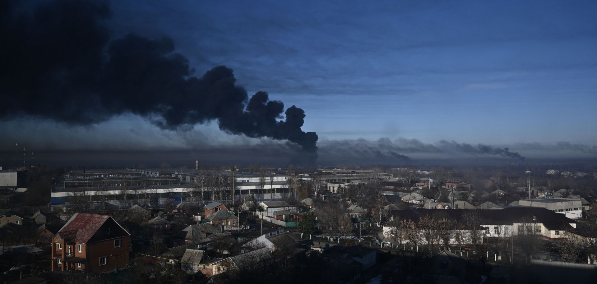 Black smoke rises from a military airport in Chuguyev near Kharkiv on Feb. 24, 2022.