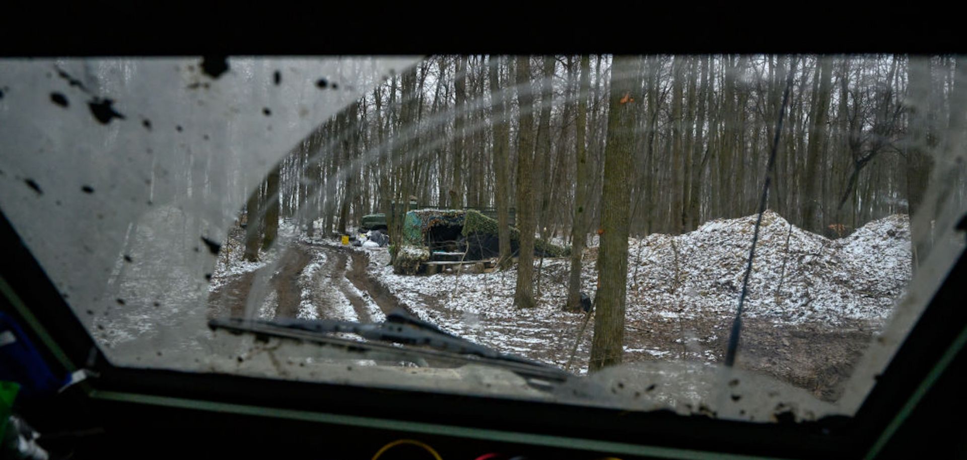 A photo taken on Jan. 15, 2025, shows a muddy track running through a forest in Sumy, Ukraine, that Ukrainian soldiers use to transport American Stryker armored fighting vehicles during Ukraine's ongoing cross-border operation into Russia's Kursk region.