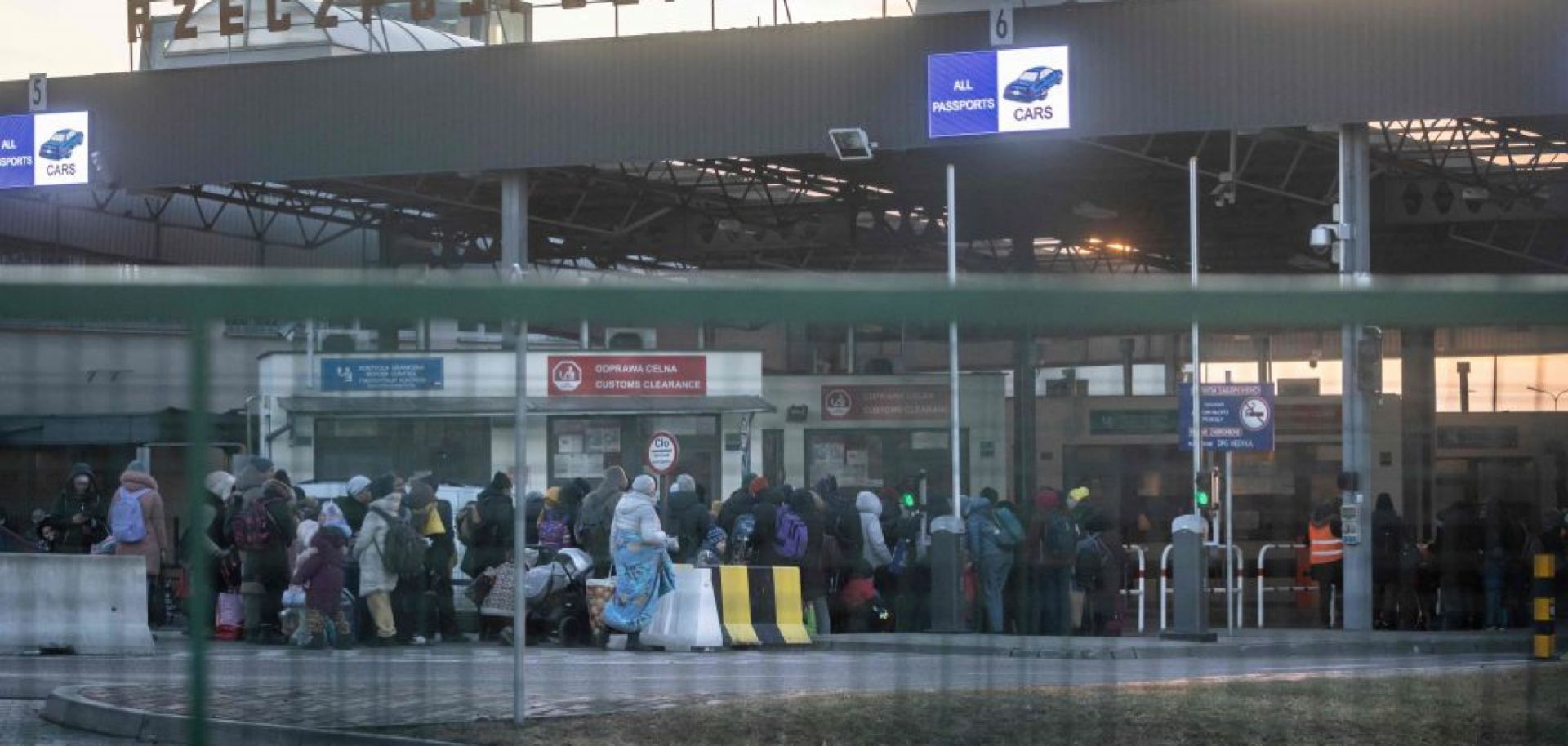 Refugees from Ukraine line up to enter Poland on Feb. 28 at the border crossing in Medyka, Poland.