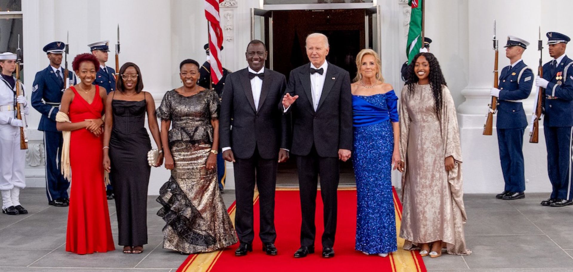 U.S. President Joe Biden and First Lady Jill Biden pose with Kenyan President William Ruto (center), alongside his wife and children, as they arrive for a State Dinner at the White House on May 23, 2024. 