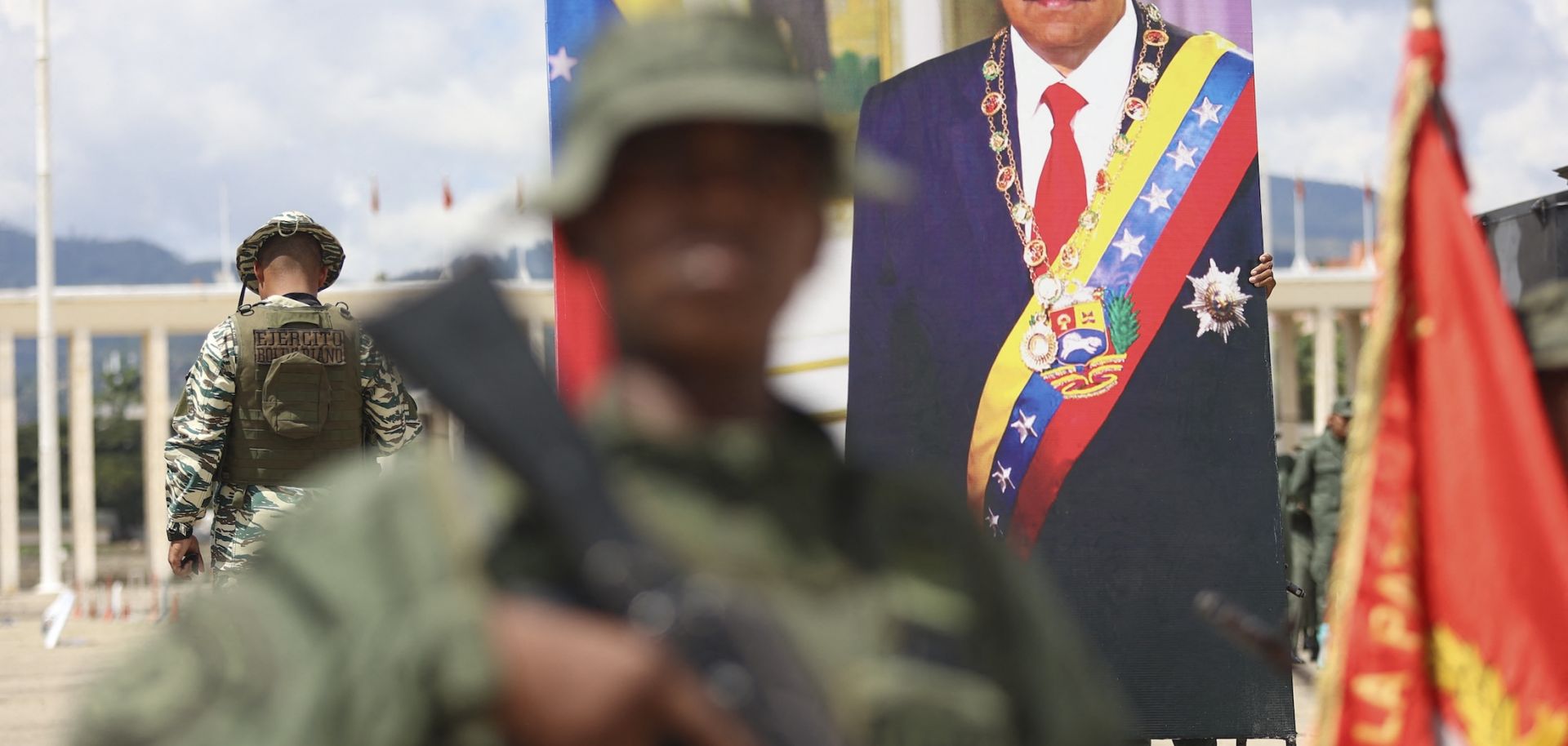 A poster displaying a photo of Venezuelan President Nicolas Maduro is seen as members of the Bolivarian Armed Forces take part in a military exercise in Caracas on Sept. 20, 2025. 
