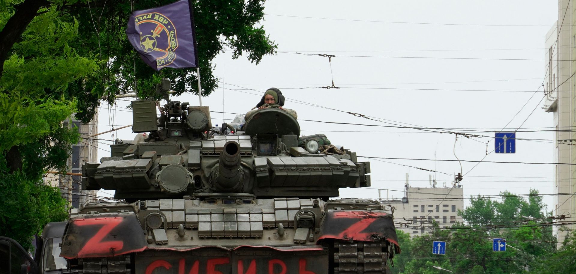 Members of Wagner Group on June 24, 2023, sit on a tank in a street in the city of Rostov-on-Don.