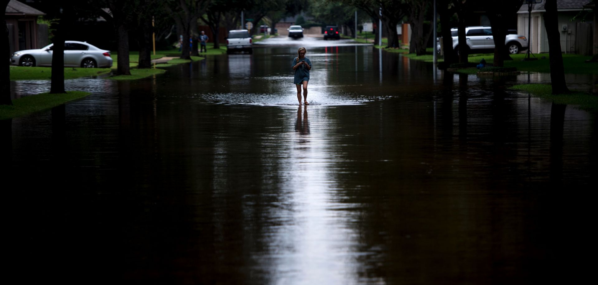 A woman walks through her flooded neighborhood in Houston, Texas, on Aug. 30.