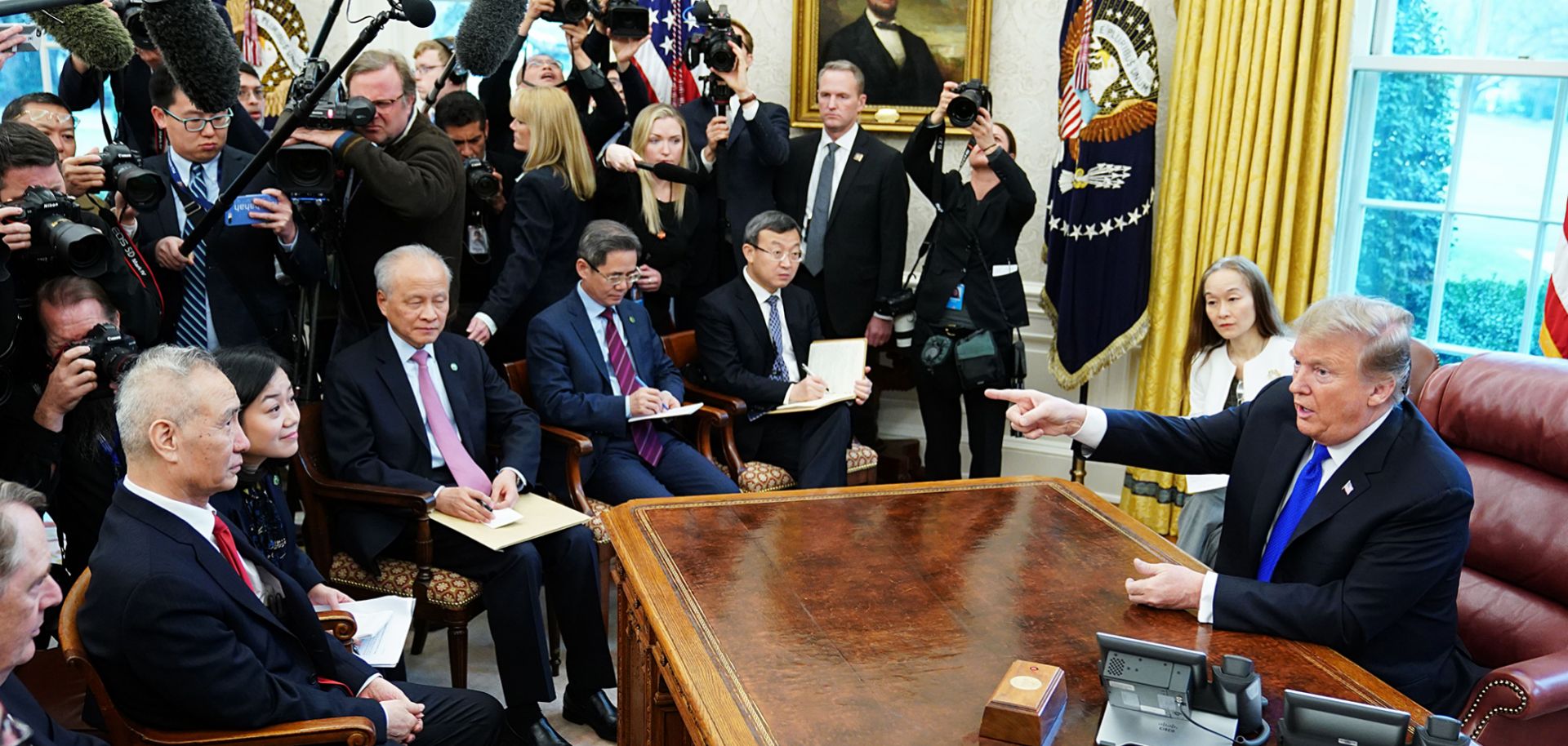 U.S. President Donald Trump takes part in a meeting with China's Vice Premier Liu He (L) in the Oval Office of the White House on Feb. 22. 
