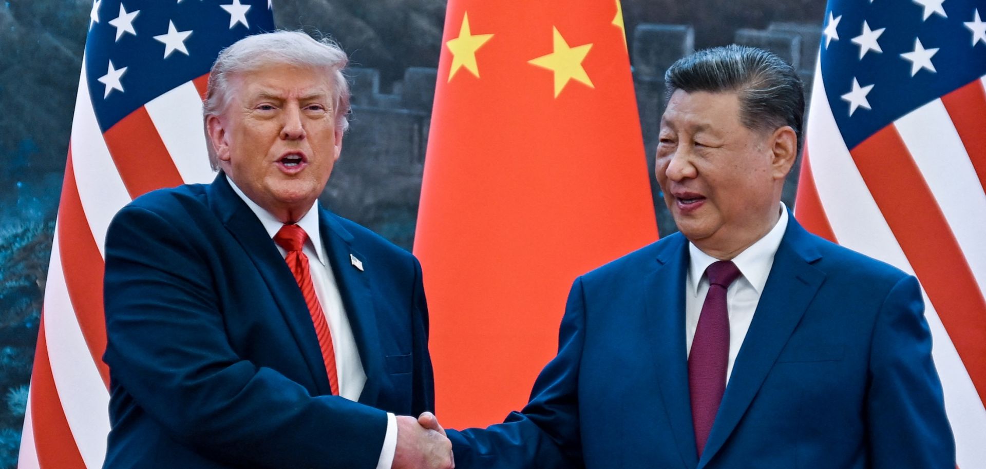 U.S. President Donald Trump (right) shakes hands with Chinese President Xi Jinping at the Great Hall of the People in Beijing on May 14, 2026.