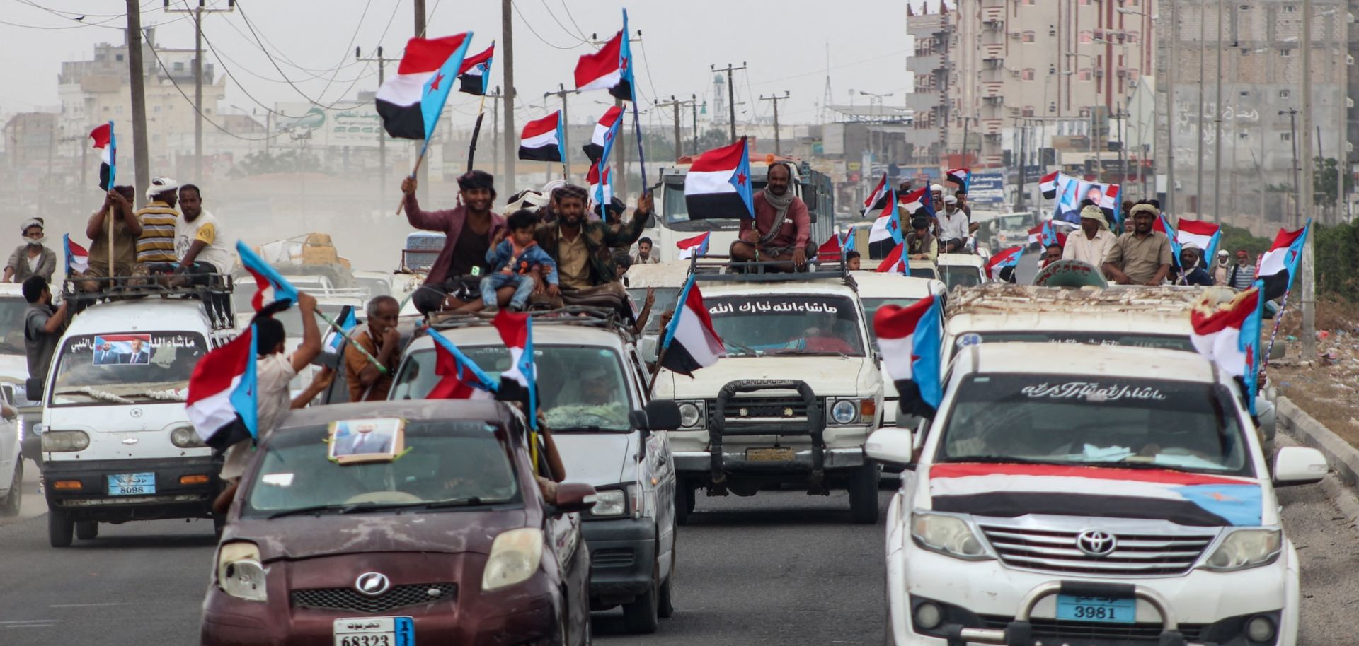 Yemenis gather during a rally to show their support for the UAE-backed Southern Transitional Council (STC), which wants to revive an independent South Yemen, as they wave the old South Yemen flag in Khormaksar Square, in the coastal port city of Aden on Dec. 14, 2025. 