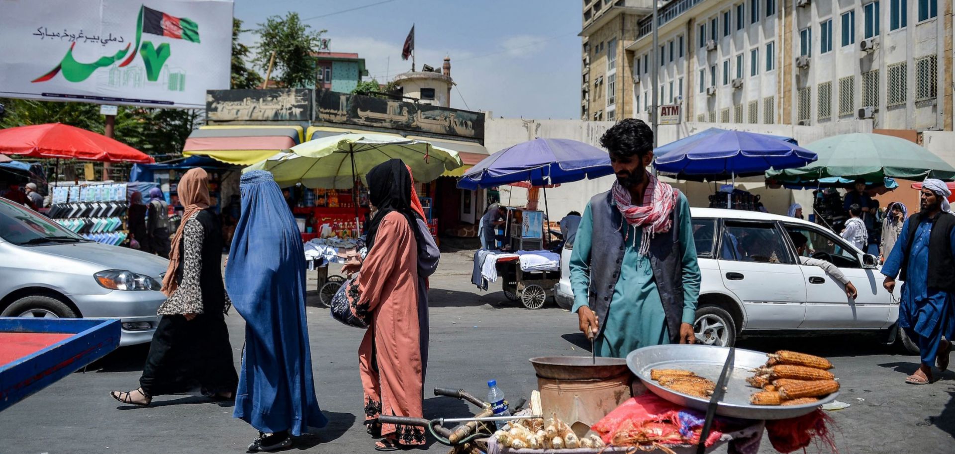 Afghan women shop at a market area in Kabul on Aug. 23, 2021, following the Taliban's takeover of the country.