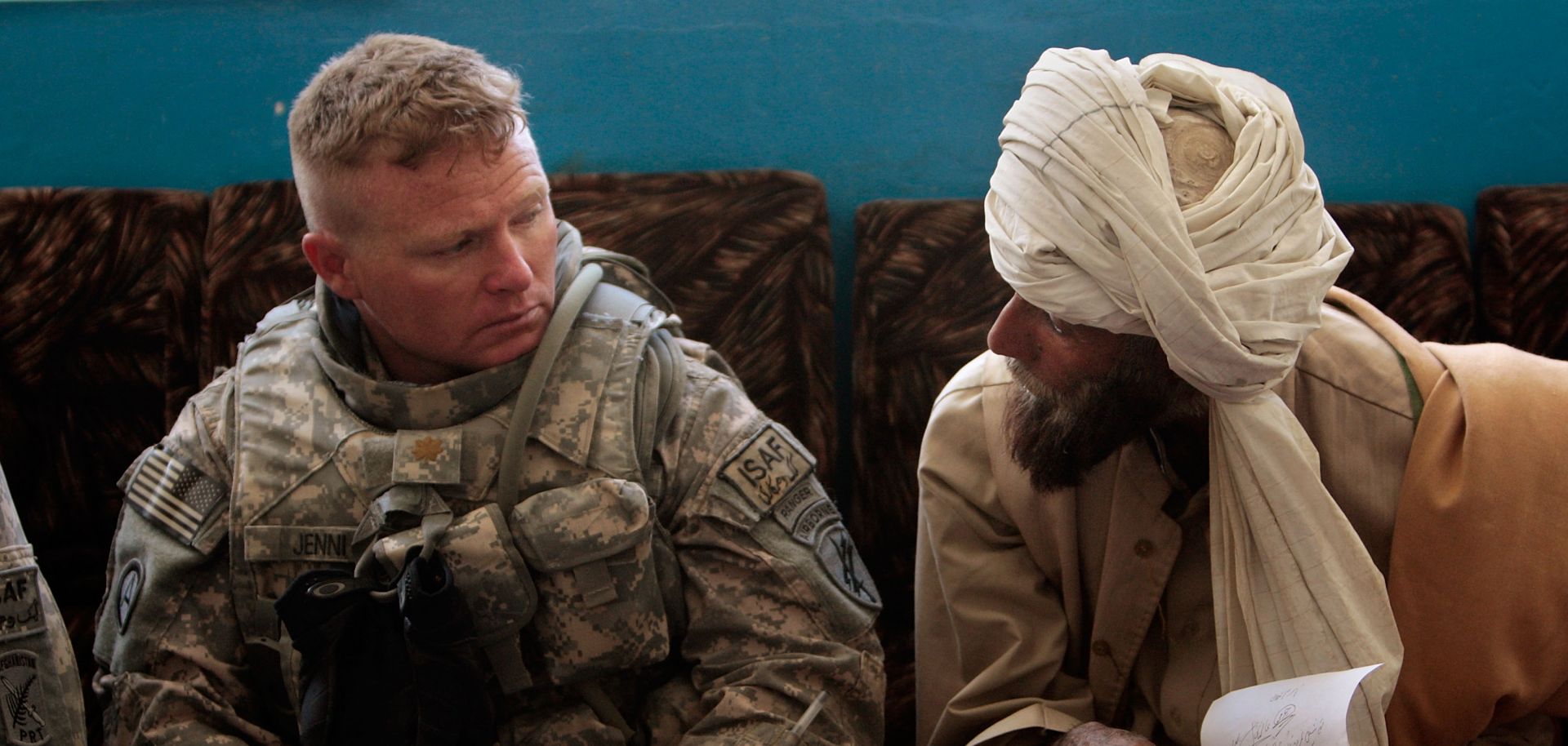 A member of the U.S. Army's 405th Civil Affairs Battalion listens to grievances during a weekly Shura to discuss issues of local governance.