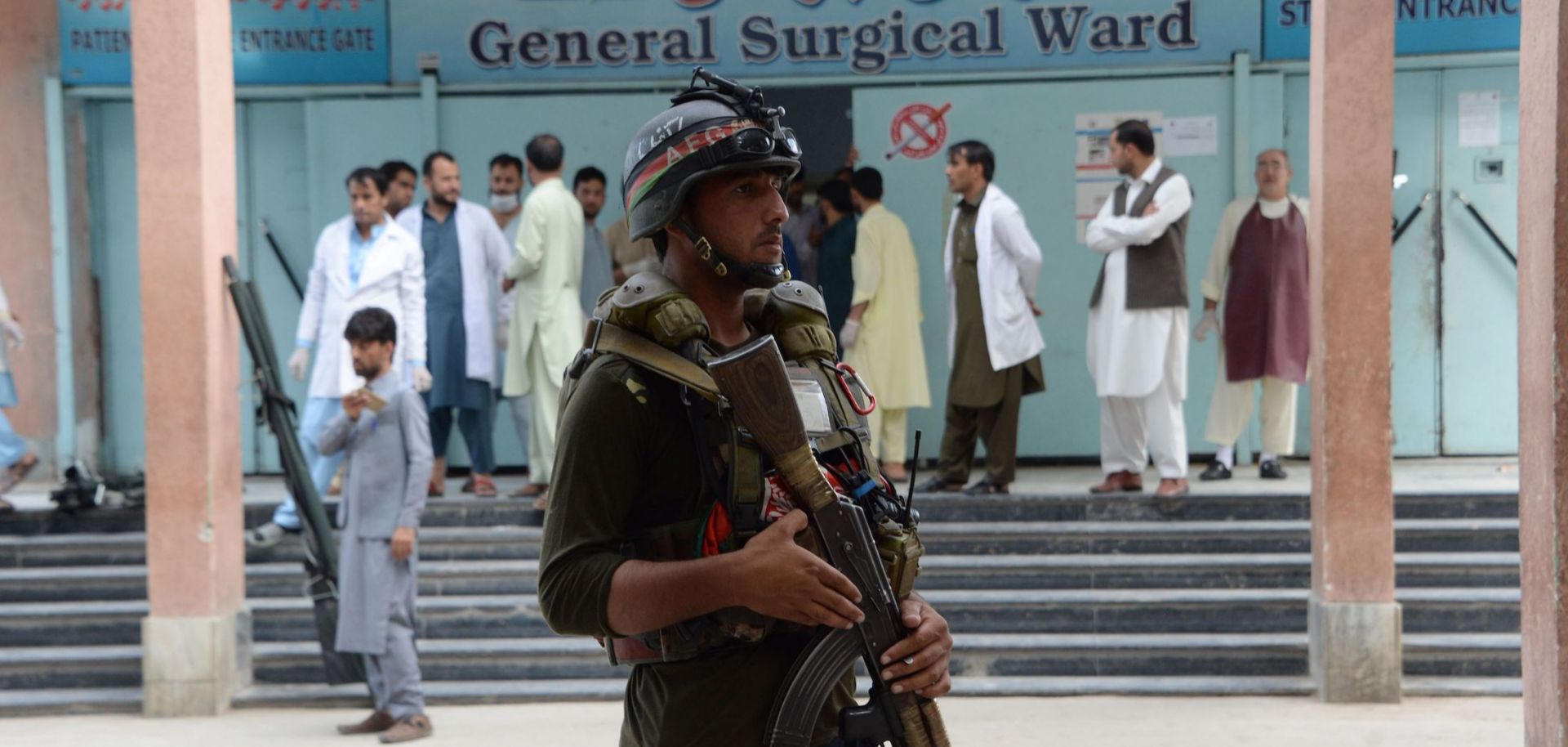 An Afghan police officer stands guard after a political rally was attacked in Nangarhar province in early October.