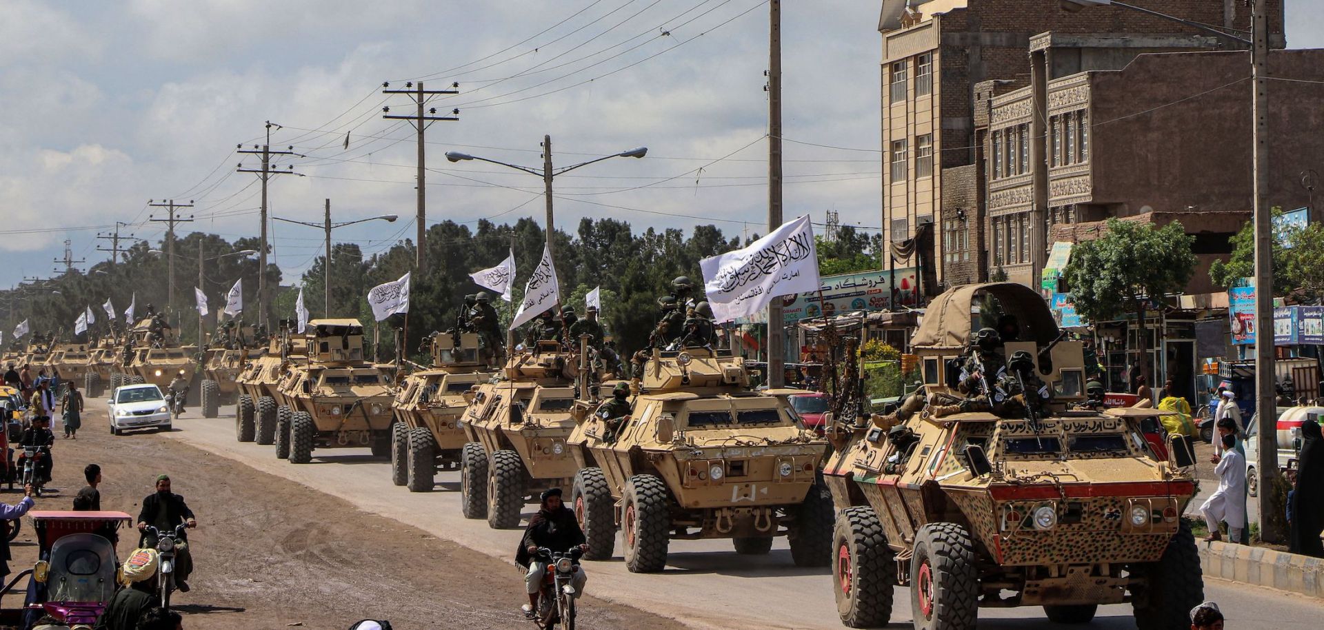 Taliban fighters in armored vehicles in a military parade on April 19, 2022, in Herat, Afghanistan.