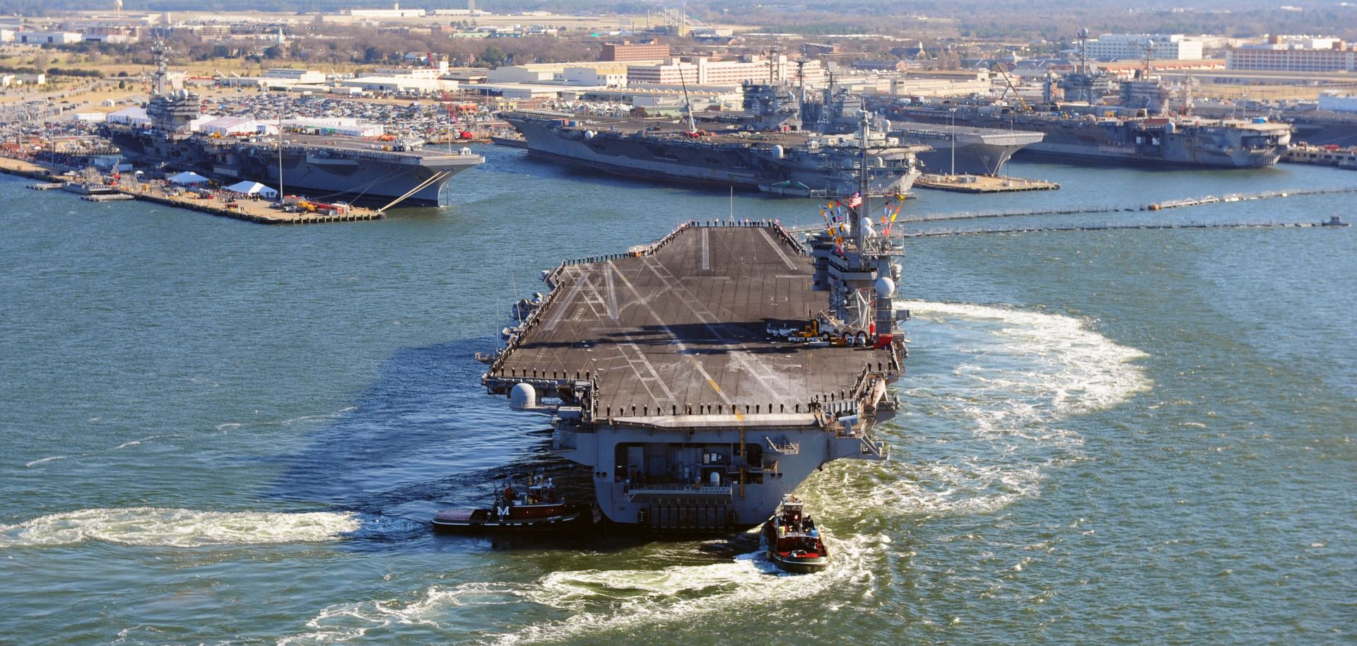 Nimitz-class aircraft carrier USS Dwight D Eisenhower sails into the Naval Station Norfolk.