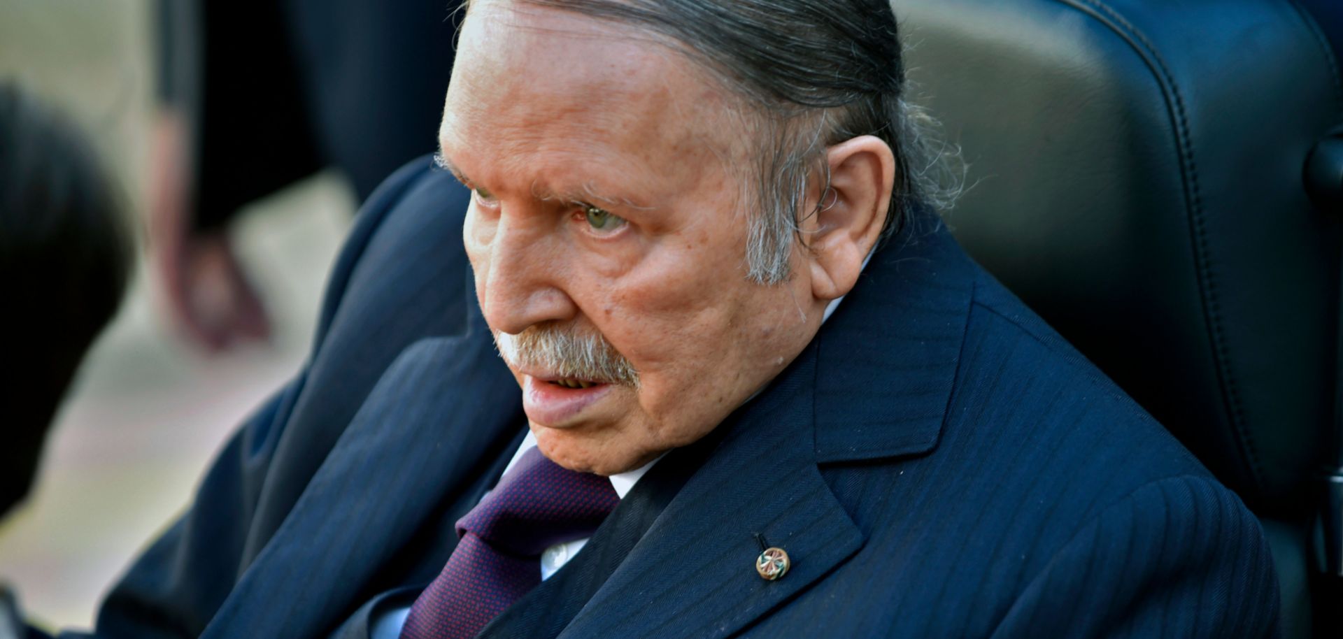 Algerian President Abdel Aziz Bouteflika is seen heading to vote at a polling station in Algiers on November 23, 2017.