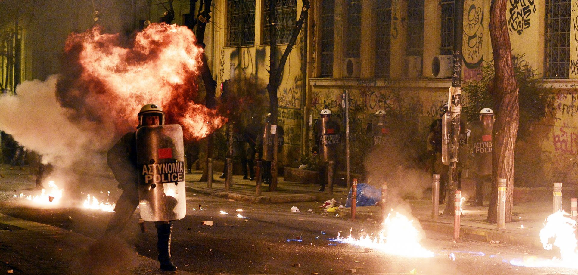 Greek riot police clash with anarchist protesters in Athens on Dec. 6, 2015. Anarchism continues to survive — and inspire — to this day, gaining momentum across the West as nationalism spreads.