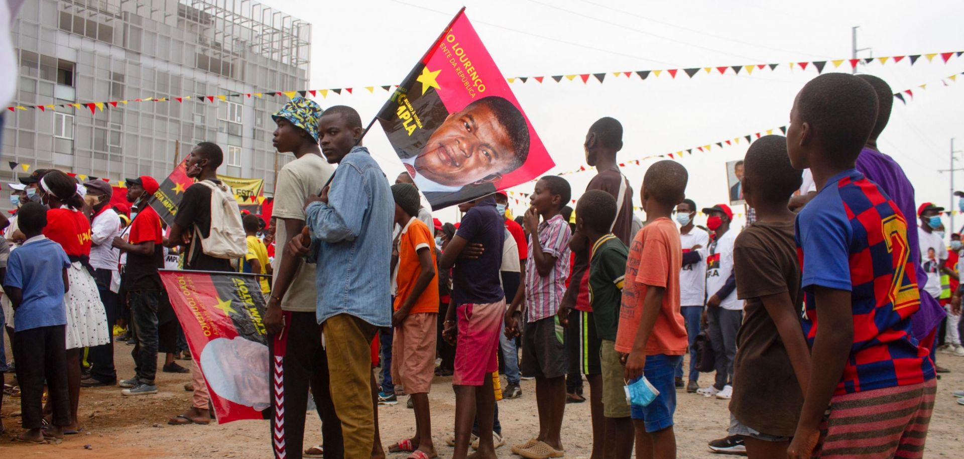 Angolan President Joao Lourenco is pictured on a flag at a campaign rally for the country’s ruling People's Movement for the Liberation of Angola (MPLA) party on June 26, 2021, at Largo das Escolas in Luanda. 