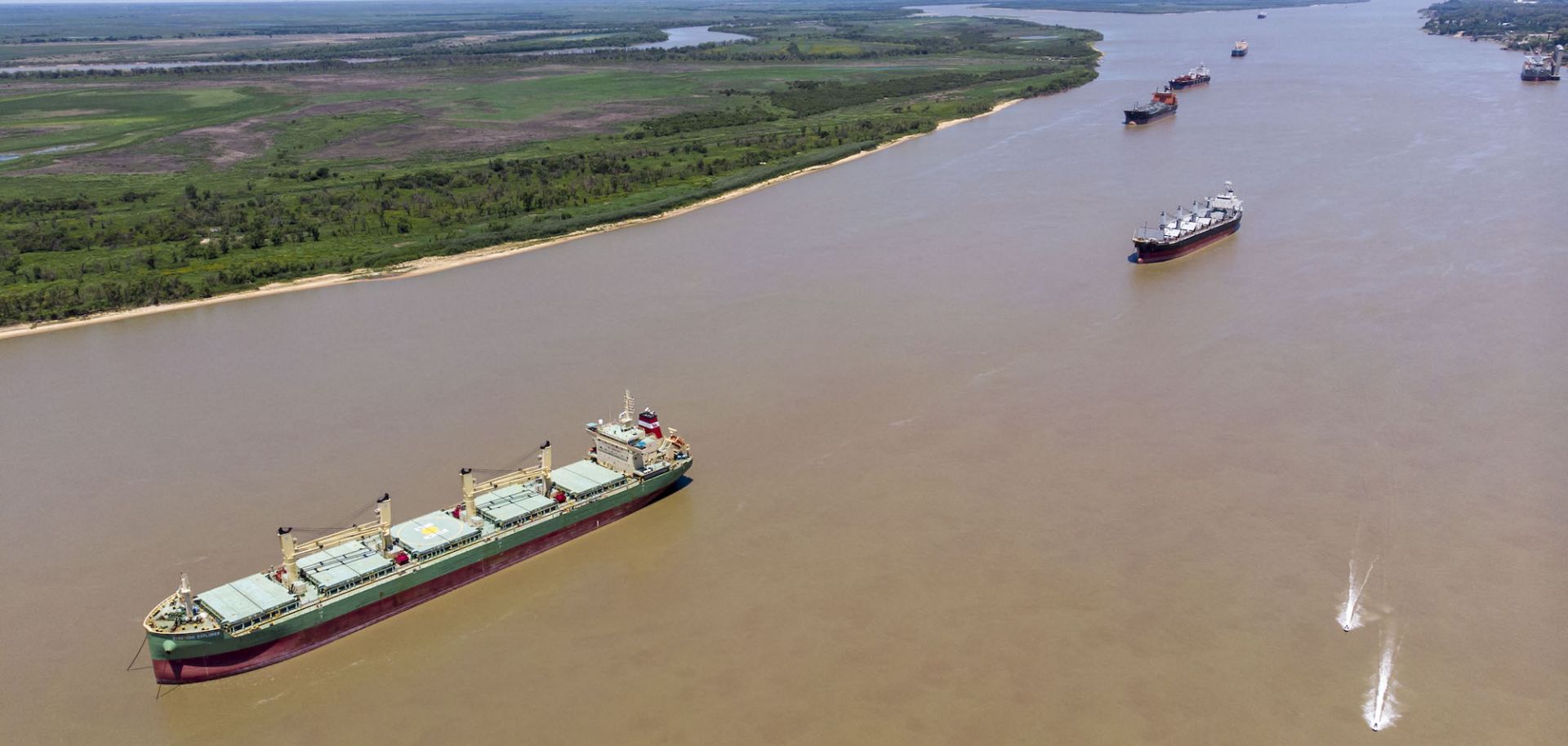 Aerial view showing cargo ships anchored on the Parana River in San Lorenzo, just north of Rosario, in the Argentine province of Santa Fe