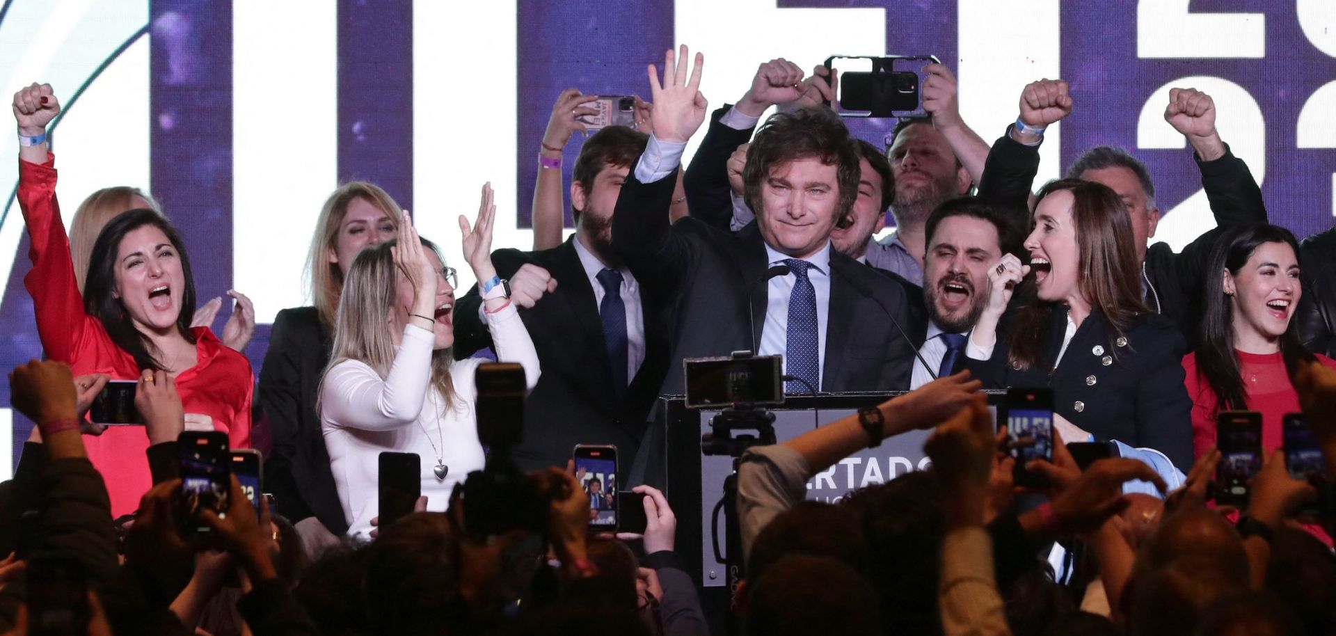 Far-right presidential candidate Javier Milei waves after delivering a speech at his headquarters in Buenos Aires on Aug. 13, 2023. 