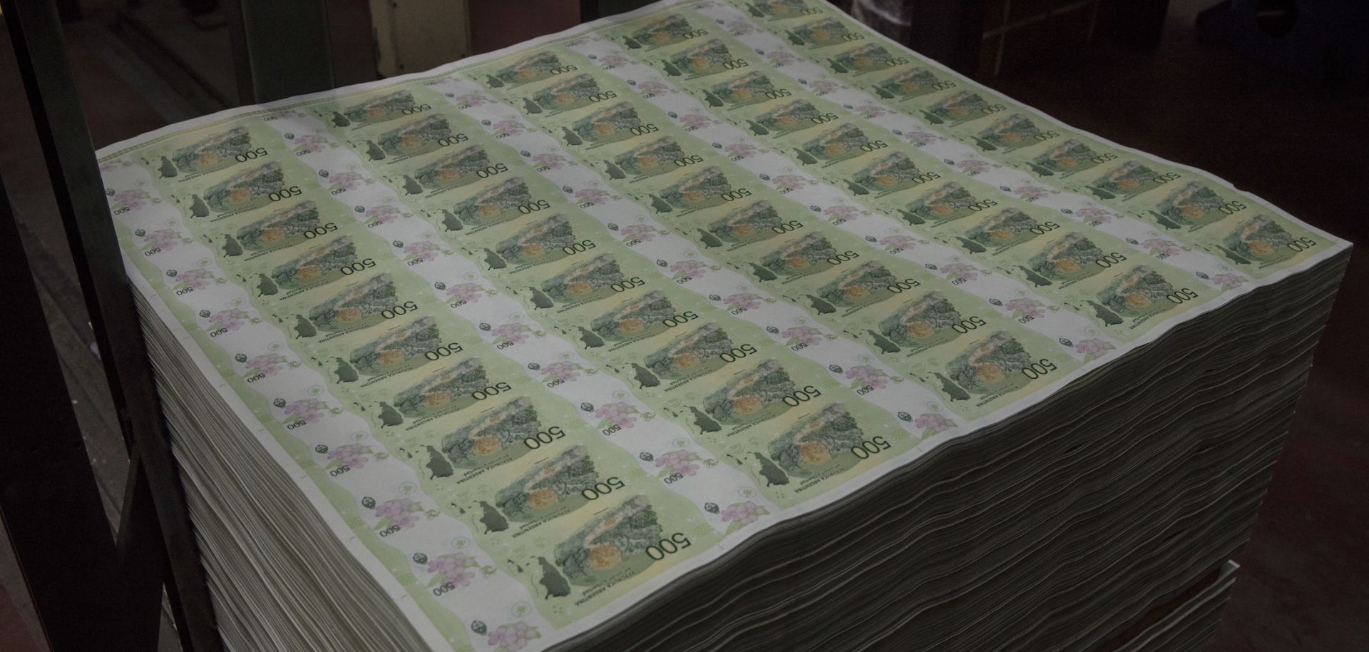 A large pile of uncut 500 Argentine peso notes waits to be sent to the cut and packaging machine at Casa de Moneda on Aug. 14, 2020, in Buenos Aires, Argentina. 