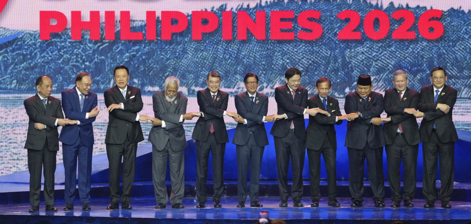 ASEAN leaders hold hands for a group photo during the opening ceremony of the 48th ASEAN summit in Cebu, central Philippines on May 8, 2026.