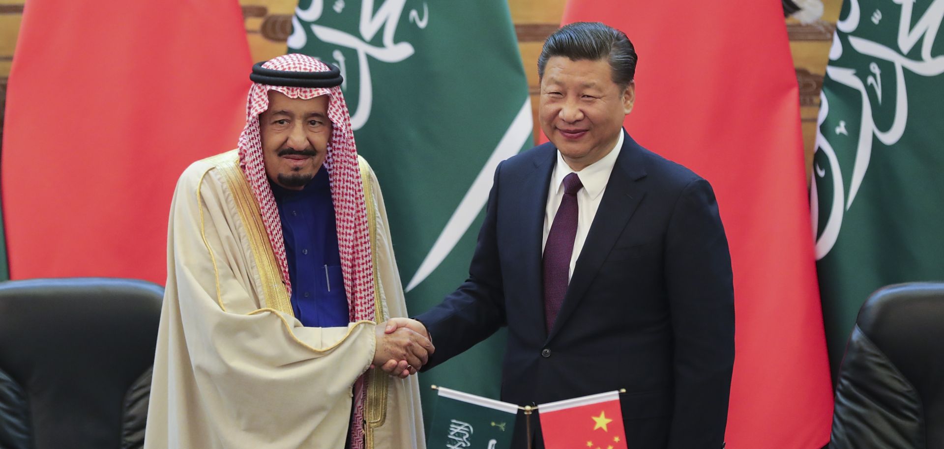 The photo shows Saudi King Salman shaking hands with Chinese President Xi Jinping during a signing ceremony in Beijing on March 16, 2017.