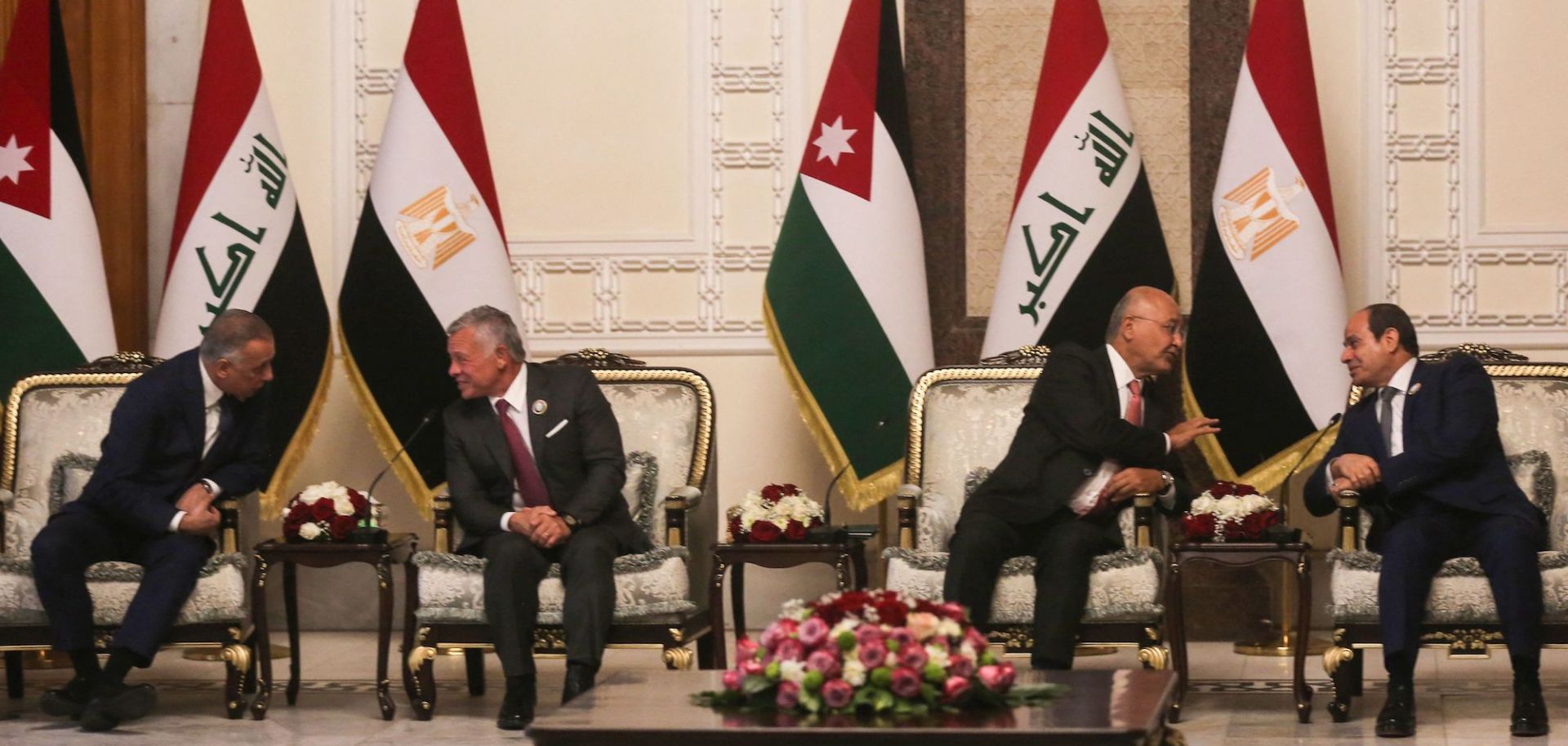 Iraqi Prime Minister Mustafa al-Kadhimi, Jordan's King Abdullah II, Iraqi President Barham Saleh and Egyptian President Abdel Fattah al-Sisi (from left to right) meet in Baghdad on June 27, 2021. 