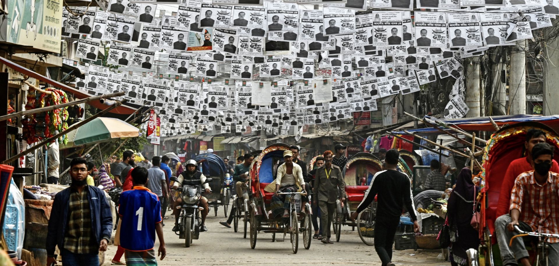 Posters of Bangladesh's election candidates hang over a street in Dhaka on Dec. 26, 2023, ahead of the 2024 general elections.
