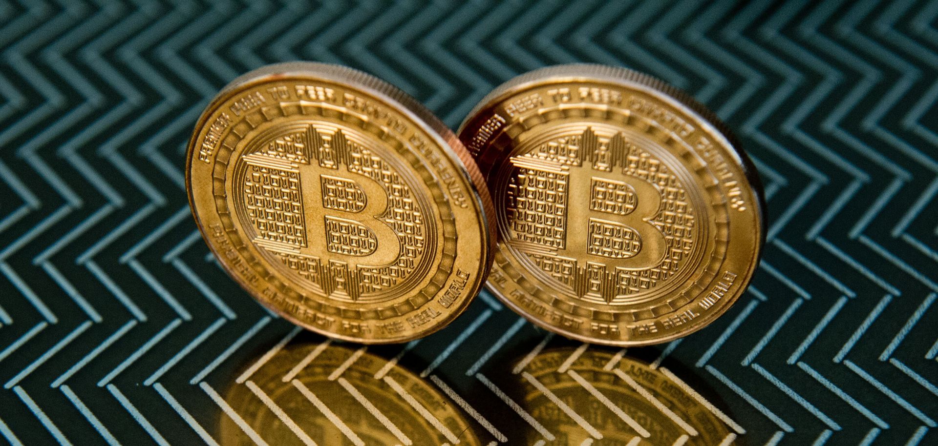 A pair of physical bitcoins, but the blockchain technology that powers the currency is far more important.