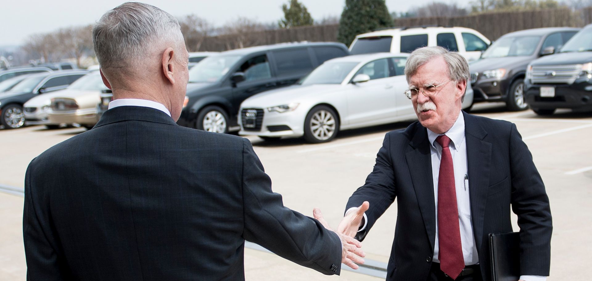 John Bolton, right, who is expected to take the helm as U.S. national security adviser on April 9, greets U.S. Secretary of Defense James Mattis outside the Pentagon.