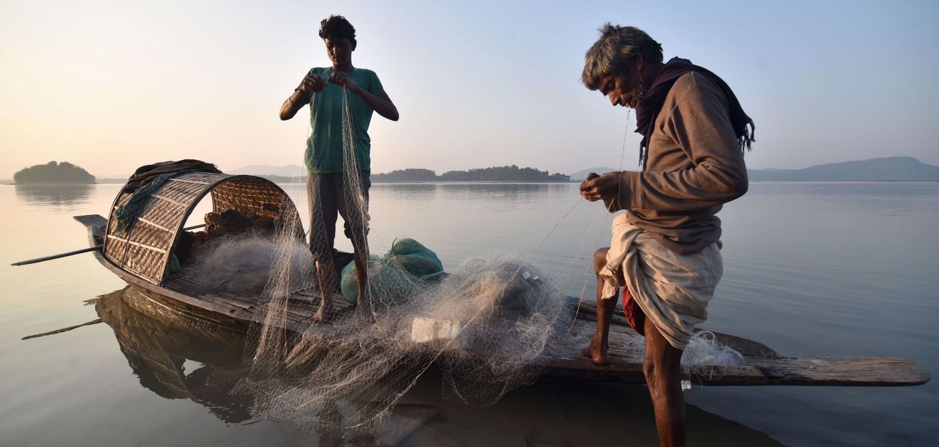 Fishermen get ready to cast their net on the Brahmaputra River, part of a massive river system that India shares with China, Nepal, Bhutan and Bangladesh.