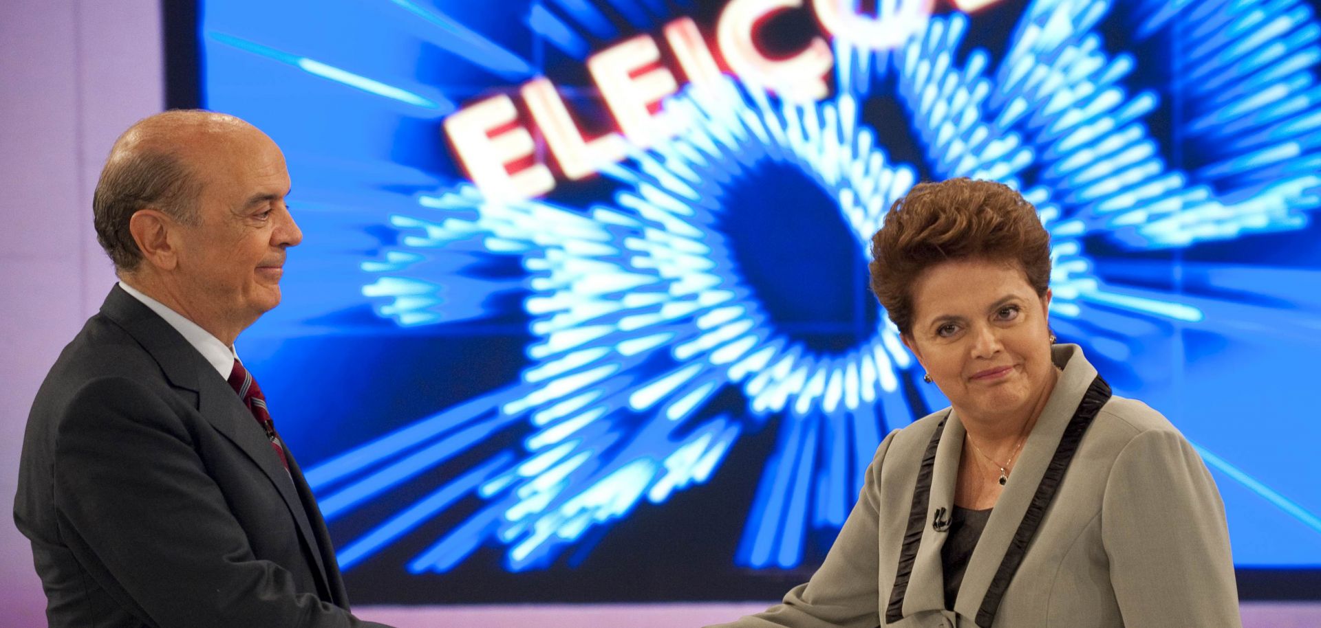 Brazil's presidential candidates shake hands before a televised debate.