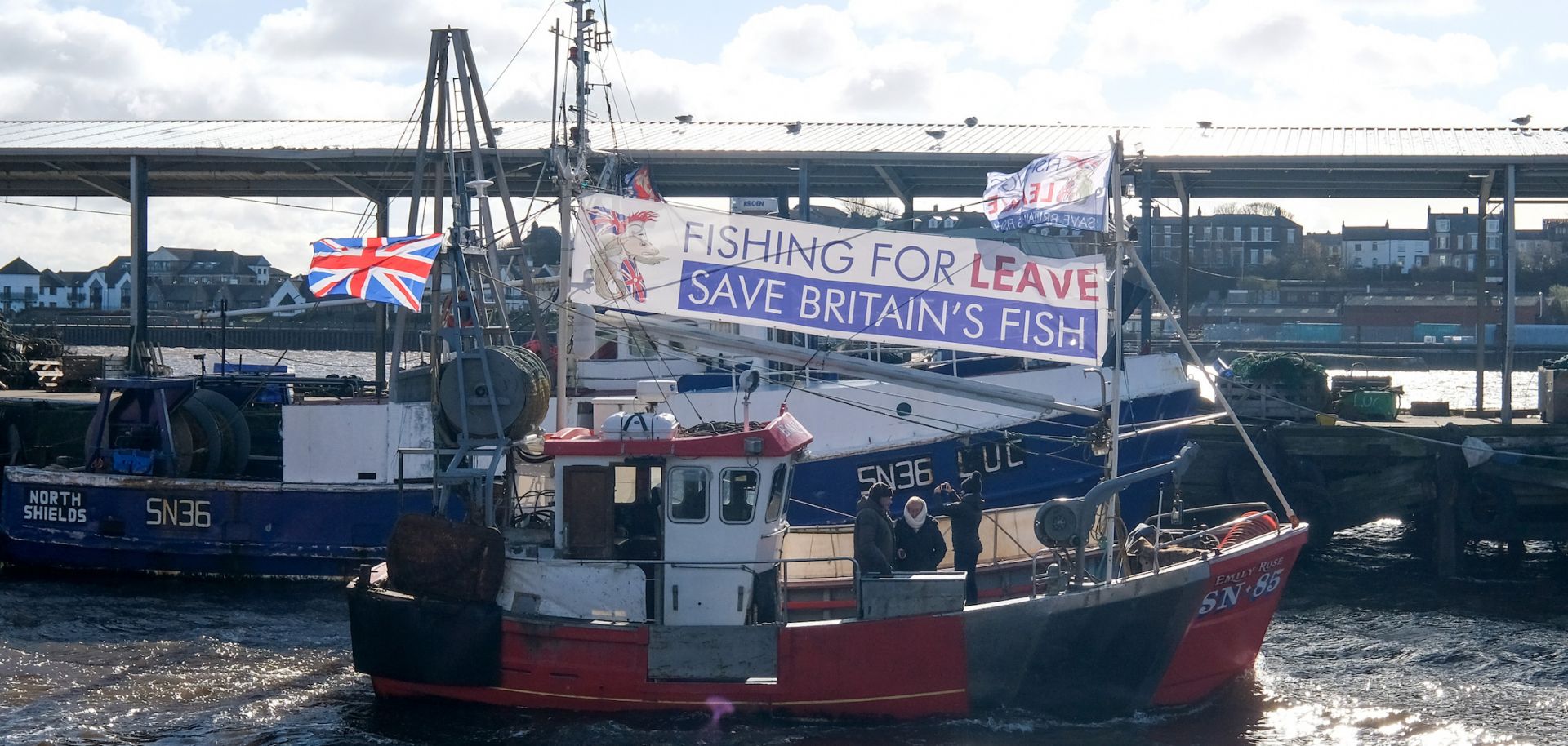 Fishing boats waving pro-Brexit flags sail up the River Tyne on March 15, 2019, in North Shields, United Kingdom. 