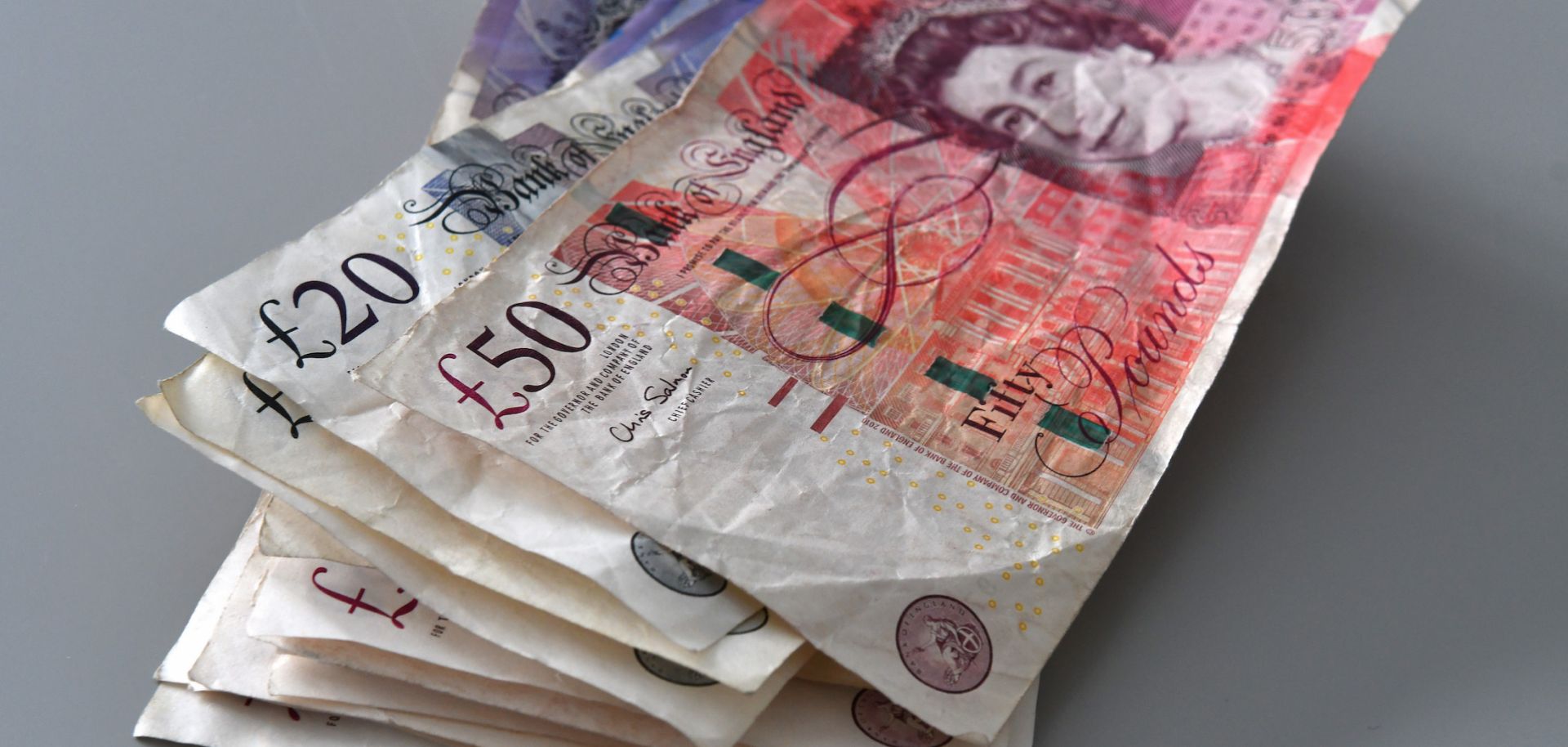 A photo illustration shows banknotes of the U.K. pound on June 28, 2020. 